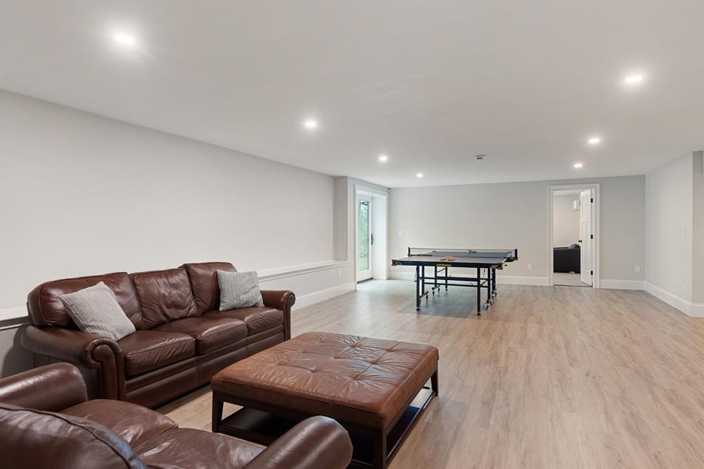 88 Hugh Cargill Road Concord, MA 01742 - Photo 31 of 36 a living room with furniture and wooden floor