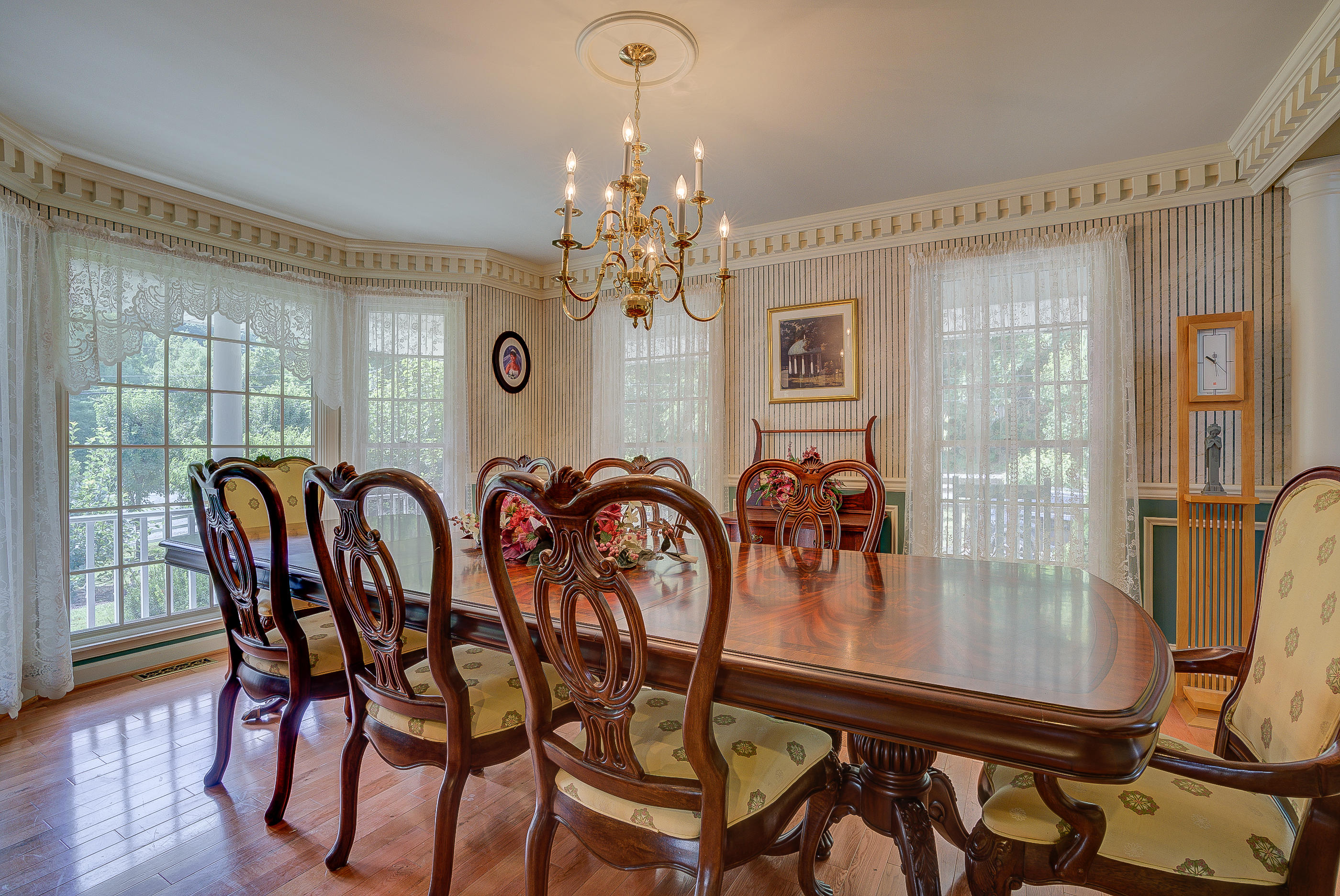 105 River Road North Covington, VA 24426 - Photo 13 of 77 a dining room with furniture a chandelier and wooden floor