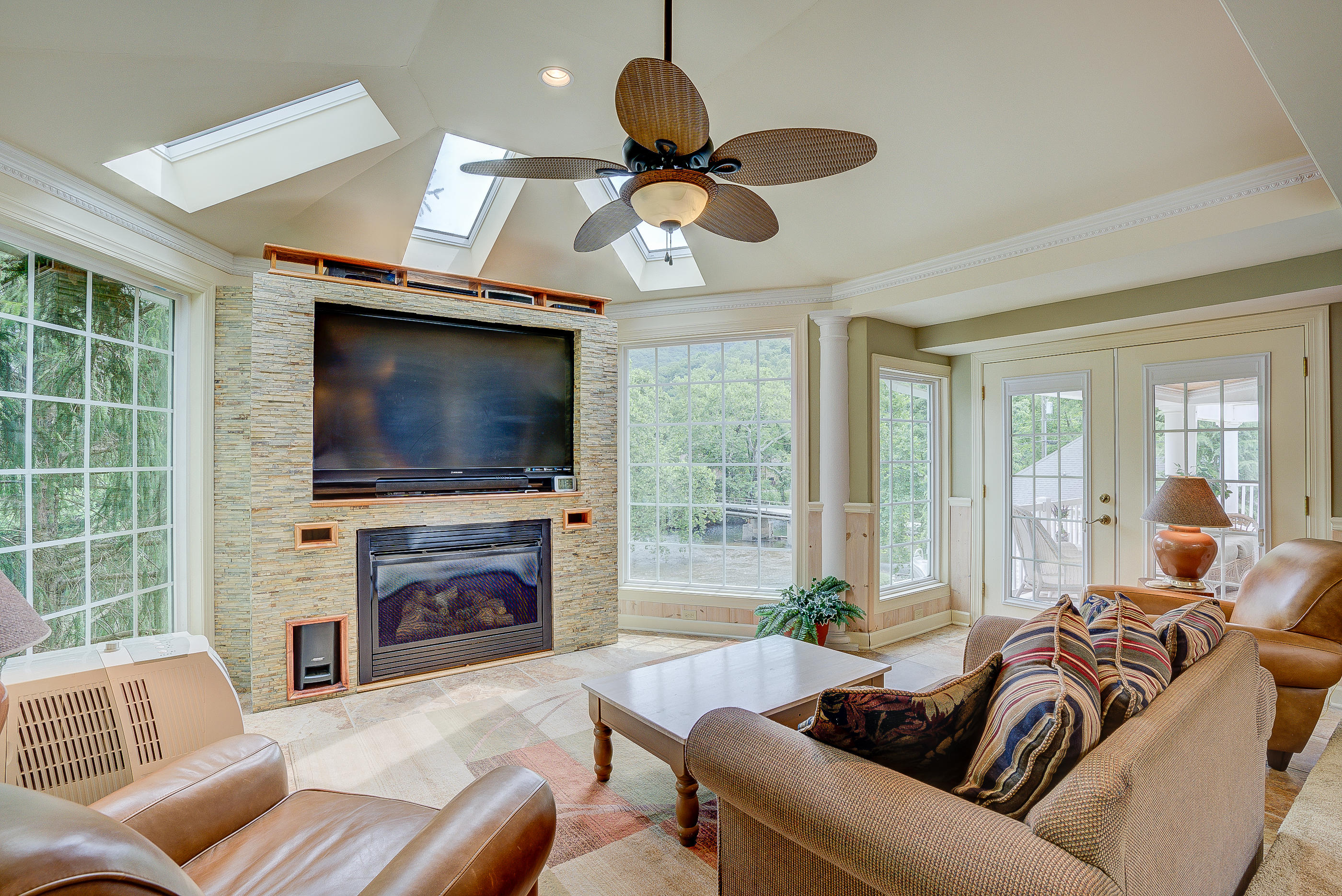 105 River Road North Covington, VA 24426 - Photo 25 of 77 a living room with furniture a flat screen tv and a fireplace