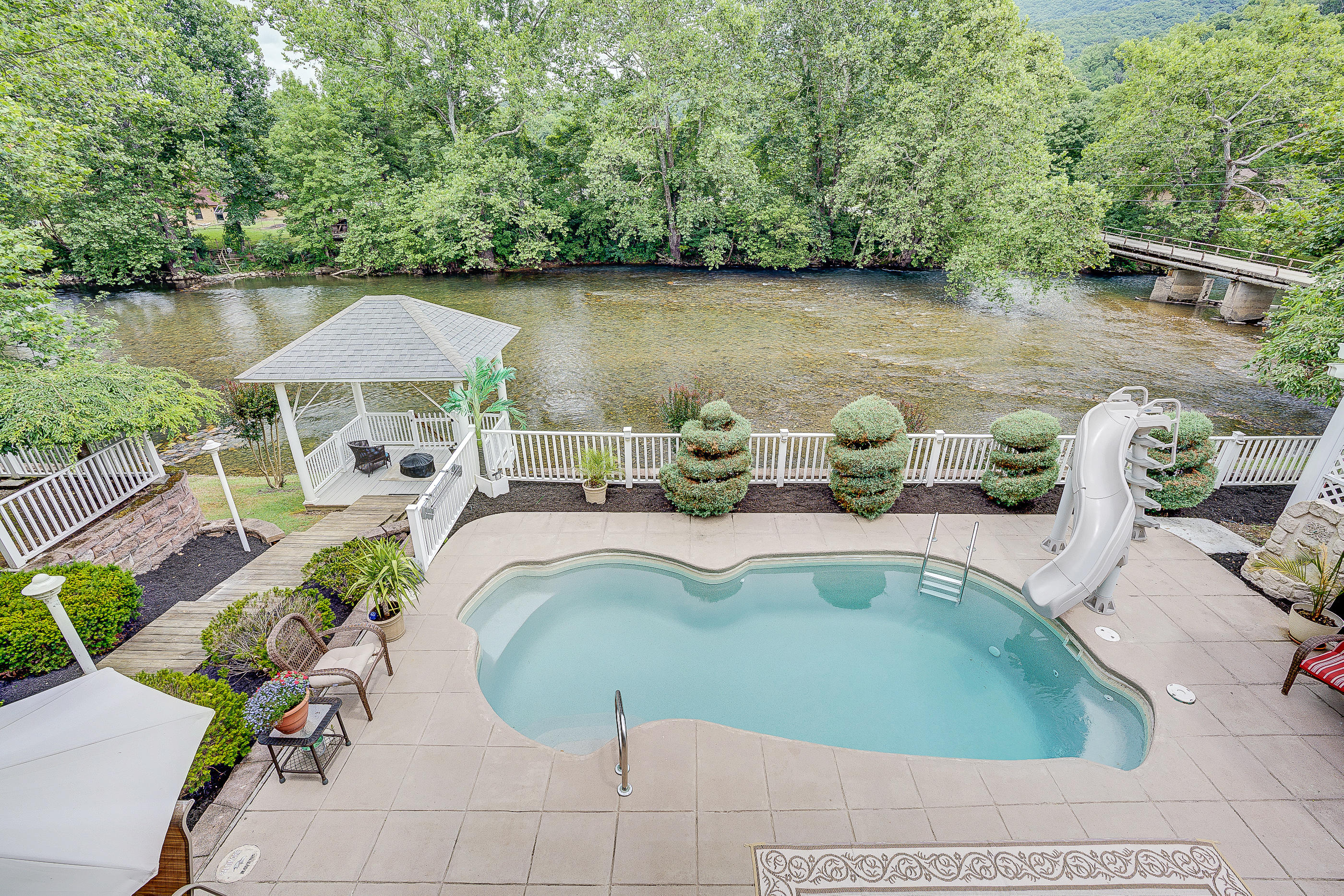 105 River Road North Covington, VA 24426 - Photo 27 of 77 a view of a swimming pool with lounge chair