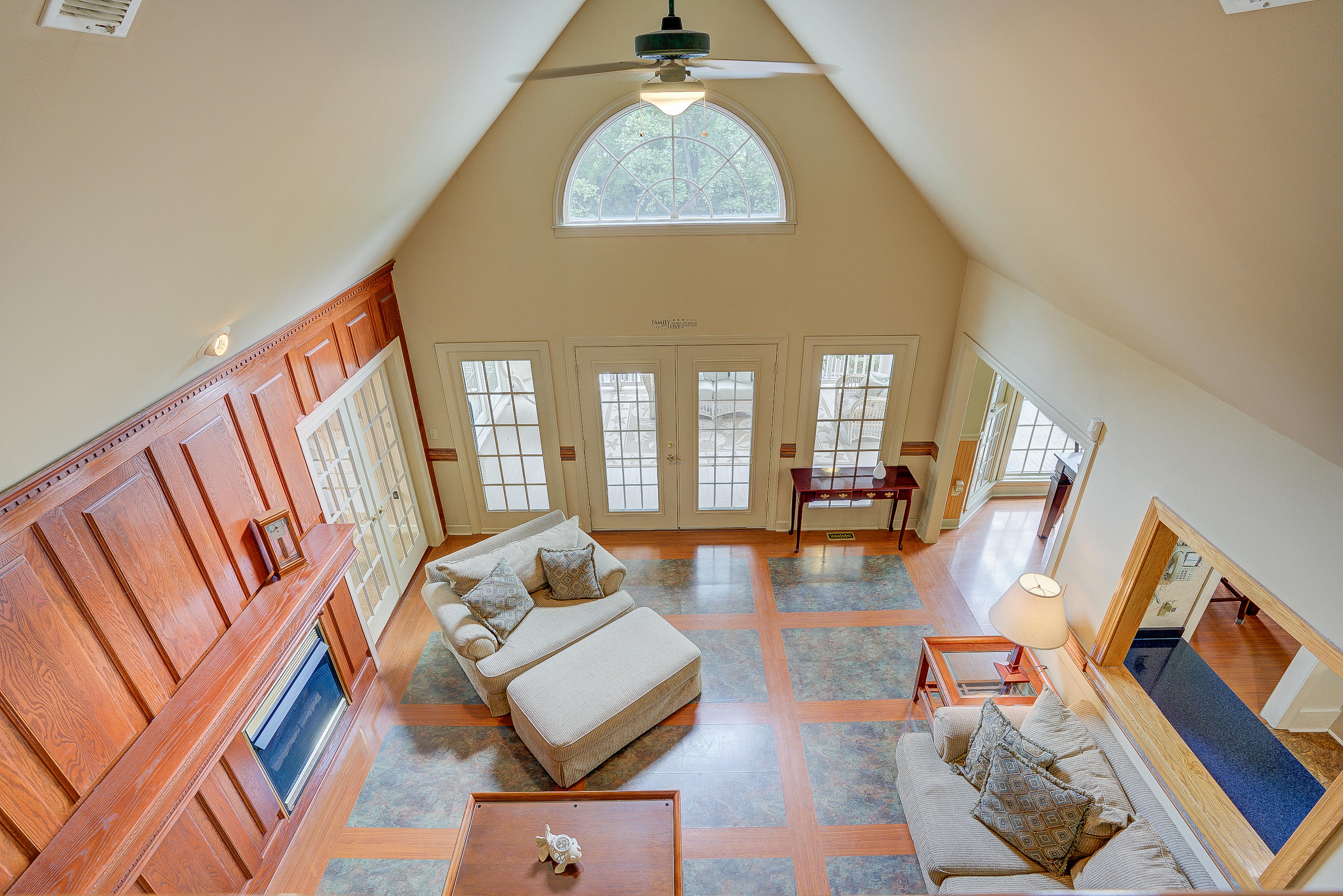 105 River Road North Covington, VA 24426 - Photo 31 of 77 a living room with couches and a dining table with wooden floor