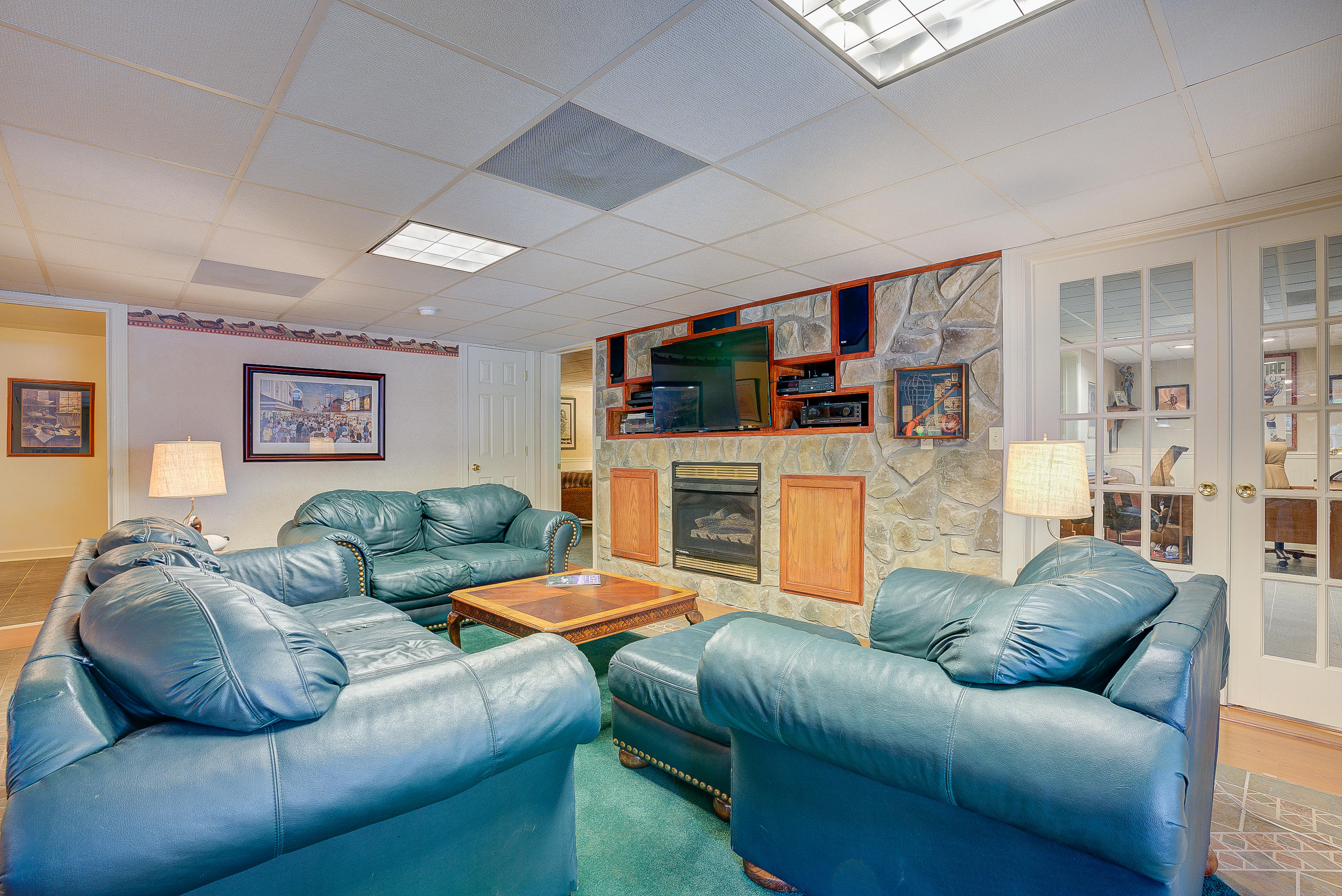 105 River Road North Covington, VA 24426 - Photo 45 of 77 a living room with furniture a fireplace and a flat screen tv