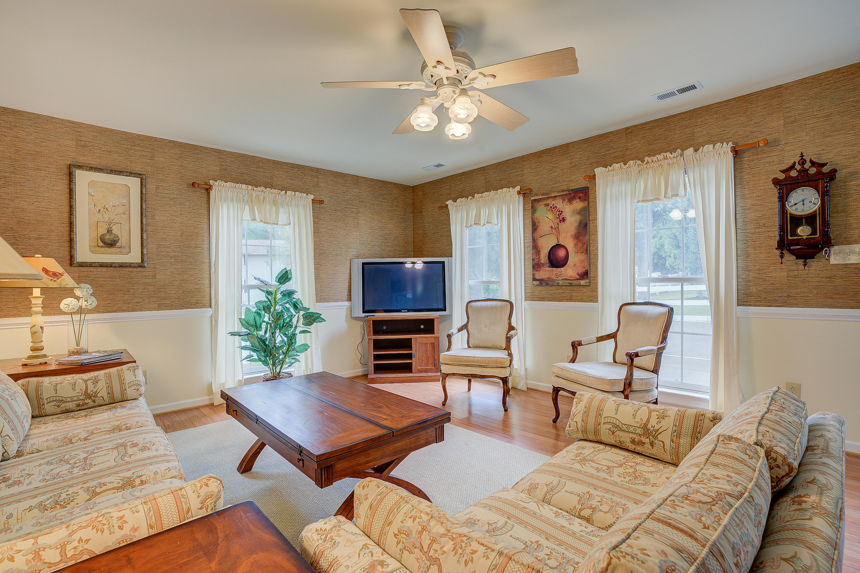105 River Road North Covington, VA 24426 - Photo 62 of 77 a living room with furniture a chandelier and a table