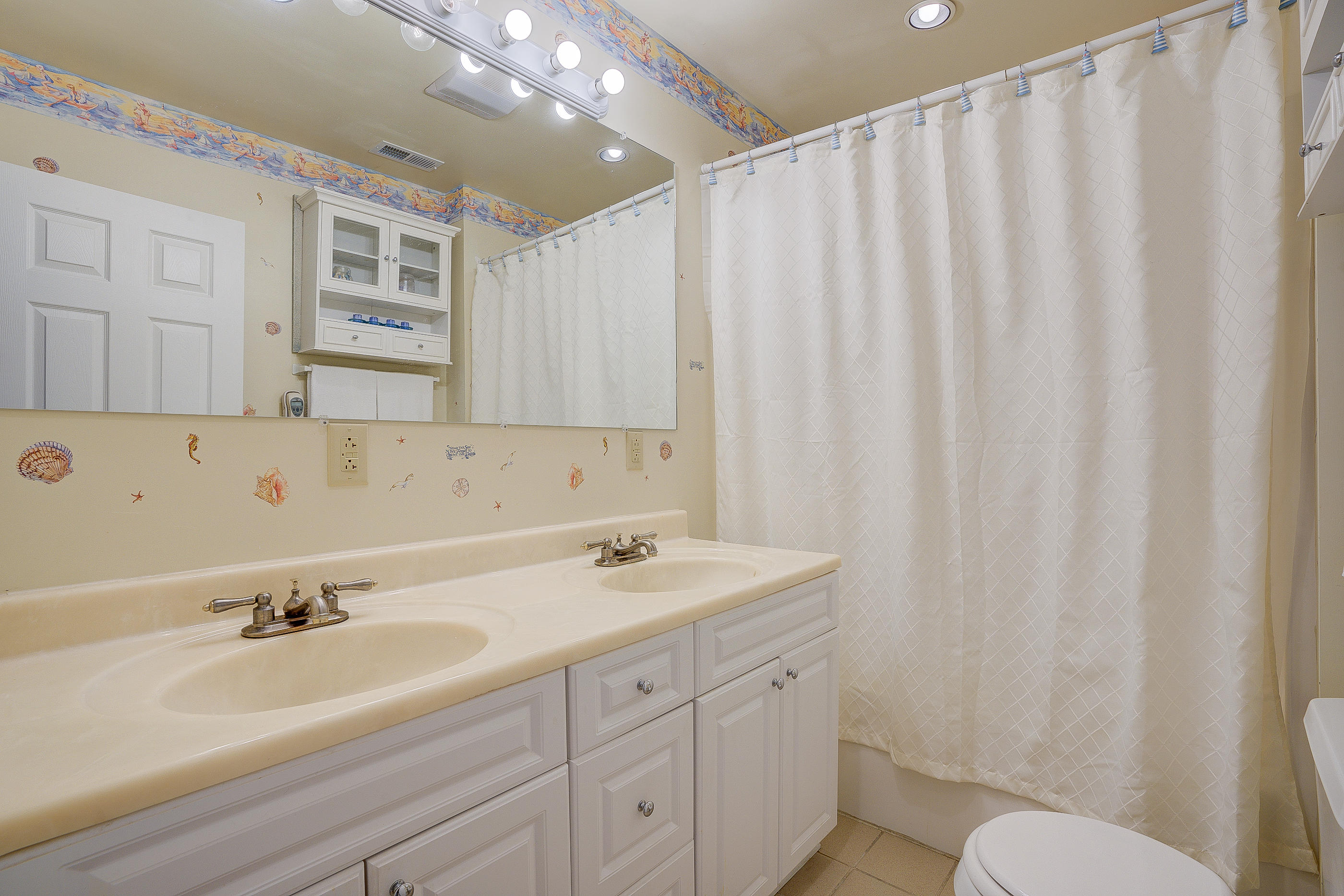 105 River Road North Covington, VA 24426 - Photo 66 of 77 a bathroom with a sink double vanity and a mirror