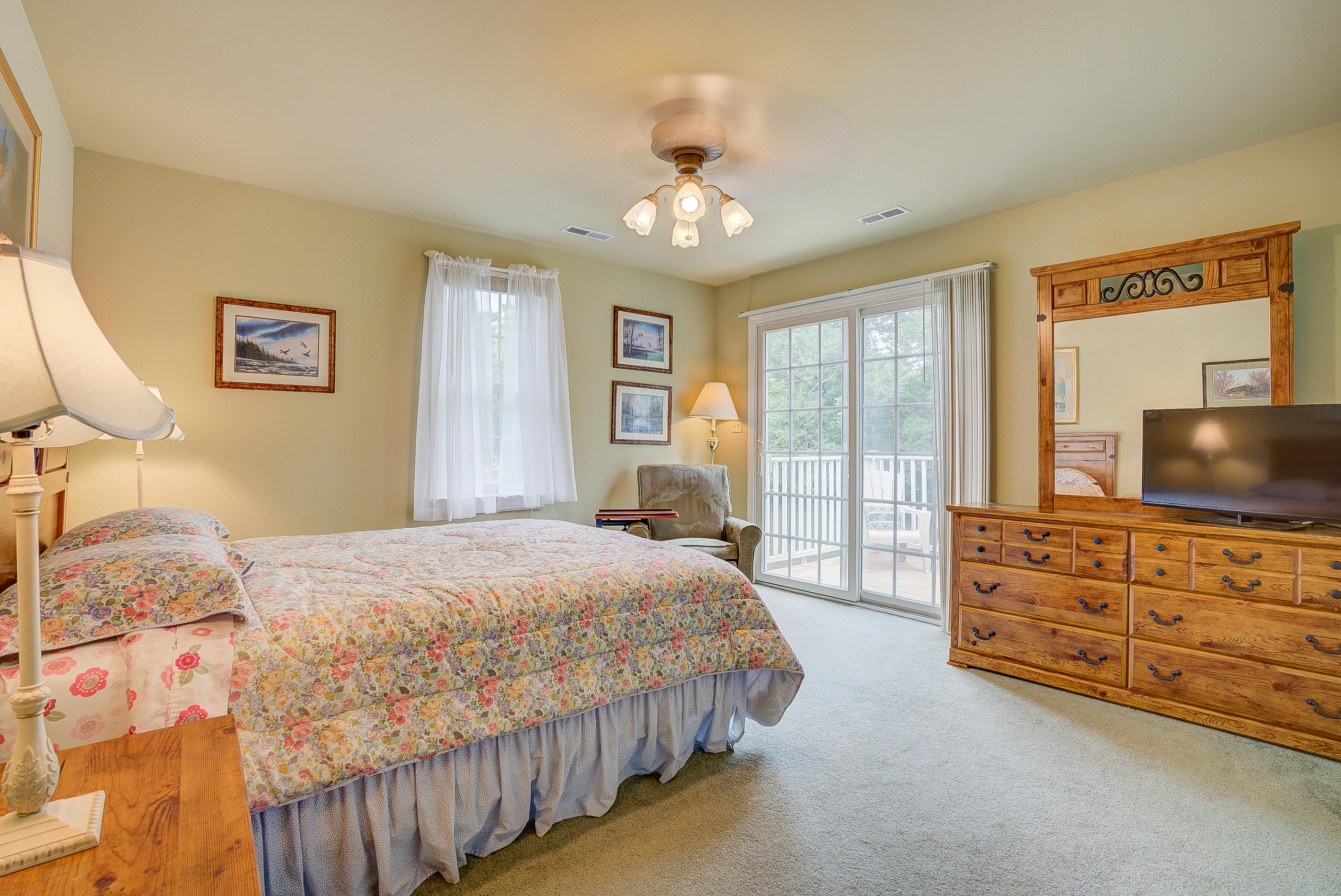 105 River Road North Covington, VA 24426 - Photo 68 of 77 a bedroom with a bed a dresser and flat screen tv