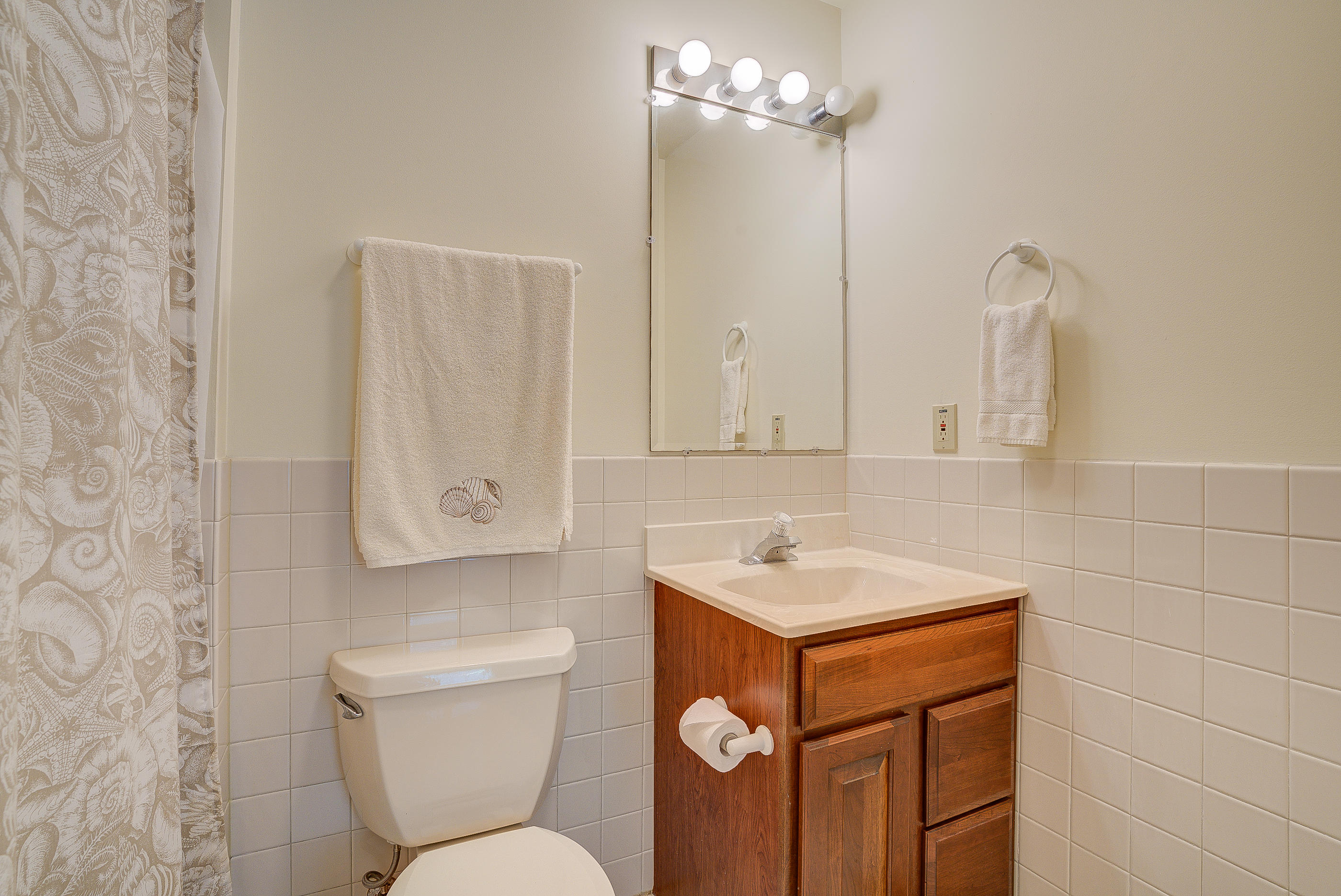 105 River Road North Covington, VA 24426 - Photo 77 of 77 a bathroom with a toilet sink and mirror