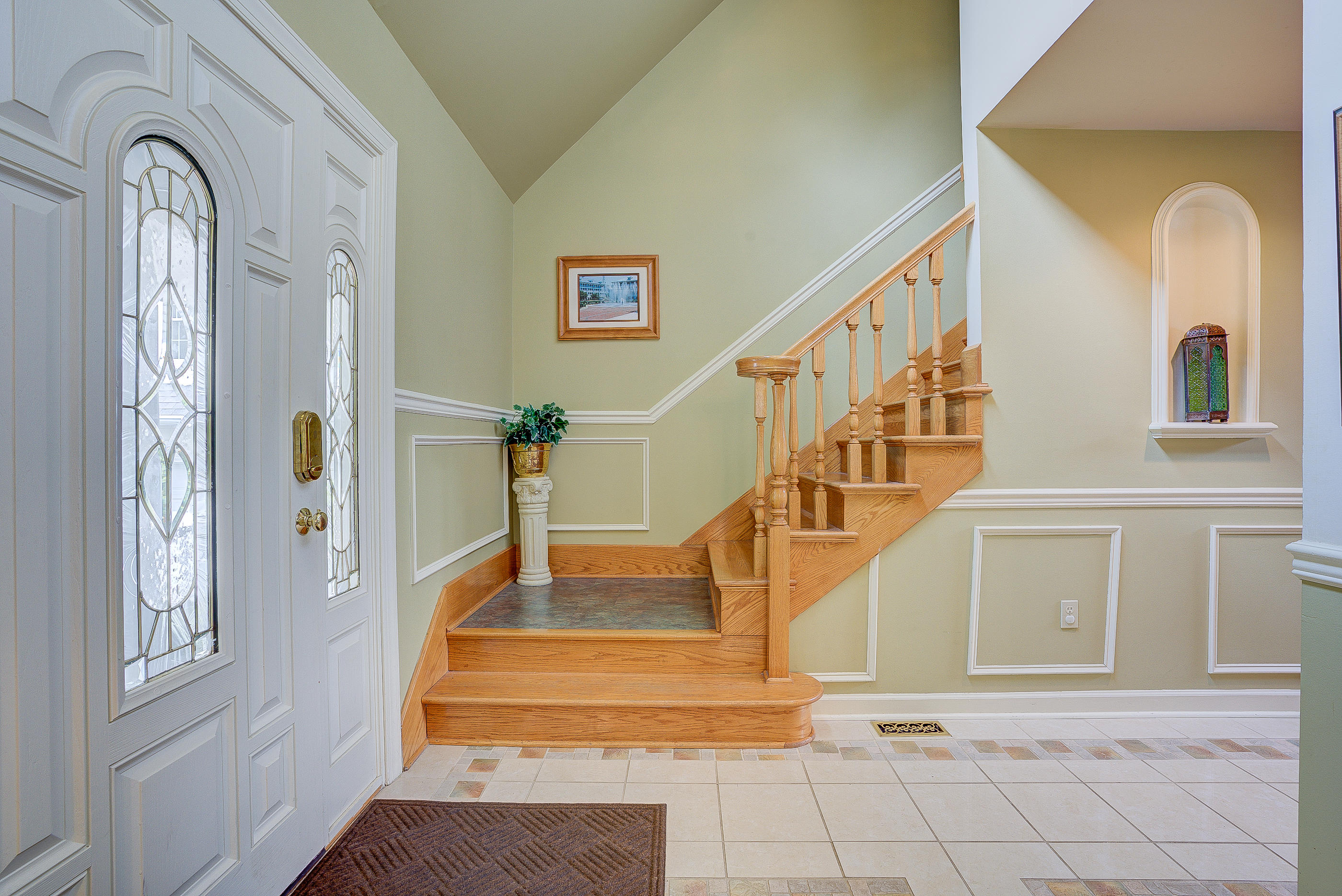105 River Road North Covington, VA 24426 - Photo 10 of 77 a view of staircase with lots of frames on wall and a large window