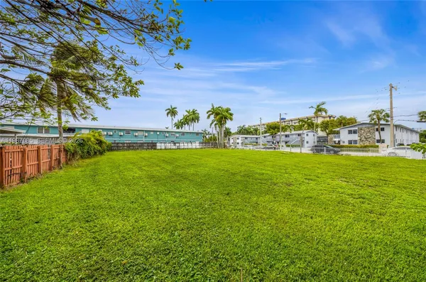 a view of yard with outdoor seating and green space