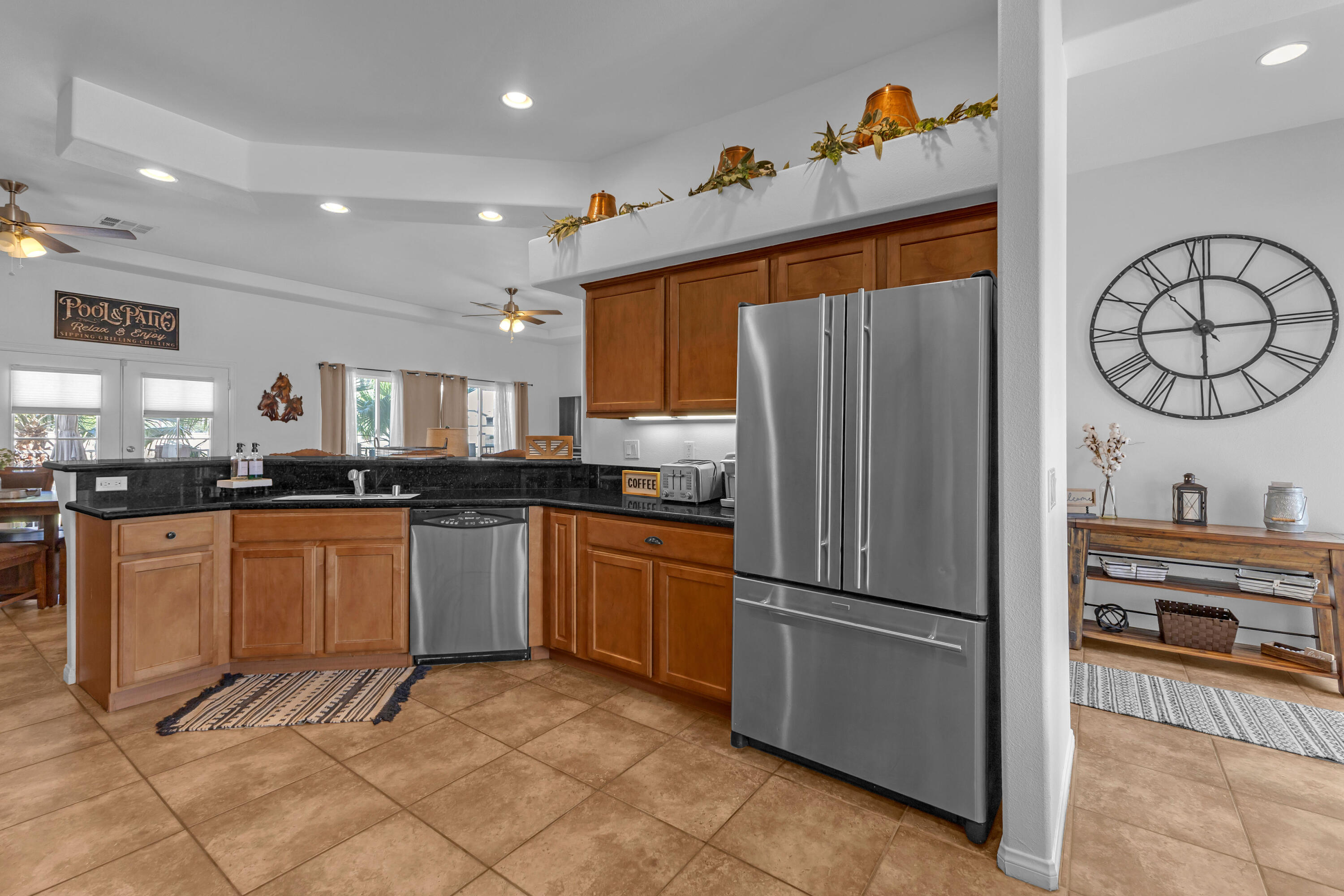 48305 Pic Way Indio, CA 92201 - Photo 12 of 77 a kitchen with stainless steel appliances granite countertop a refrigerator and a sink