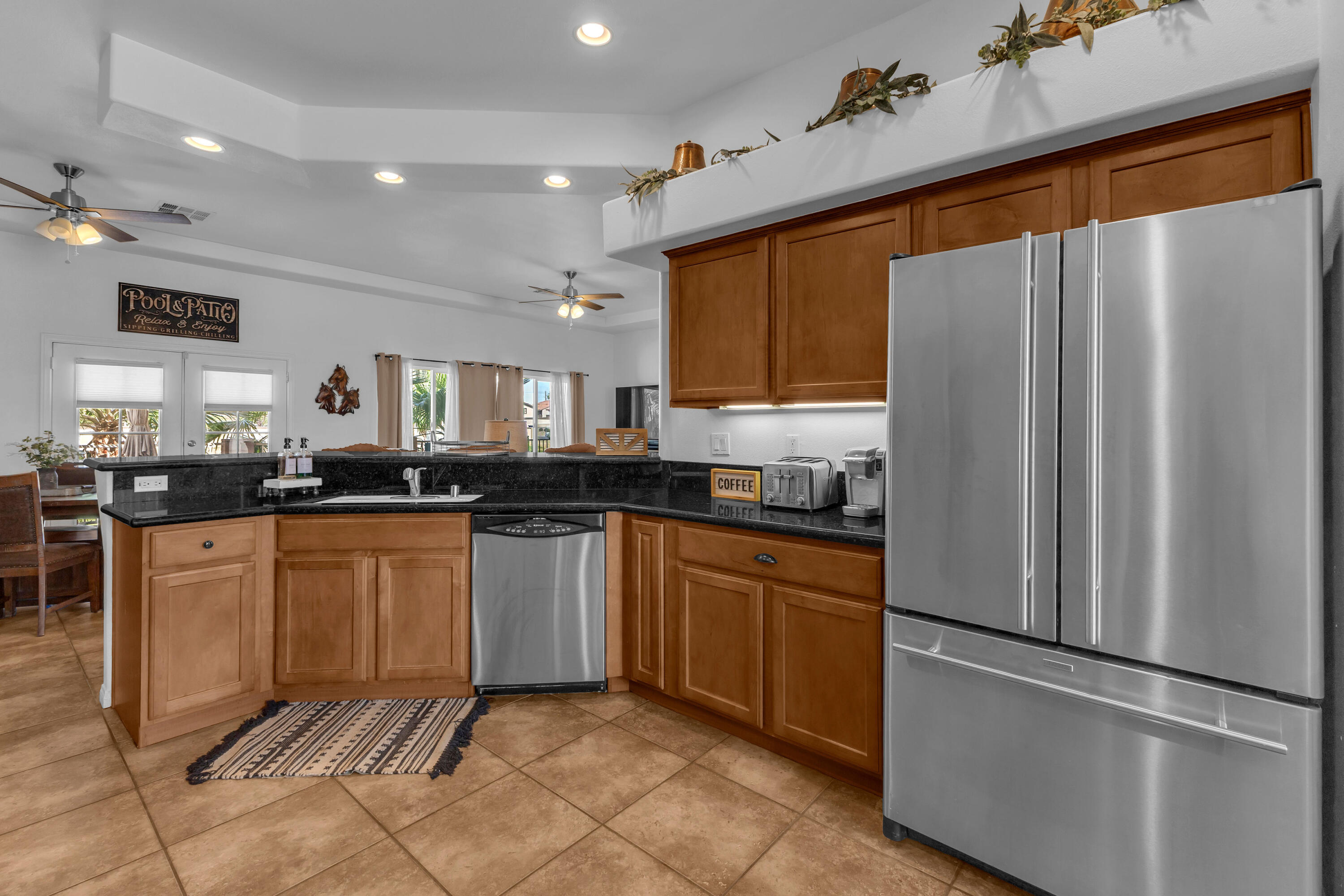 48305 Pic Way Indio, CA 92201 - Photo 13 of 77 a kitchen with stainless steel appliances granite countertop a refrigerator and a stove top oven
