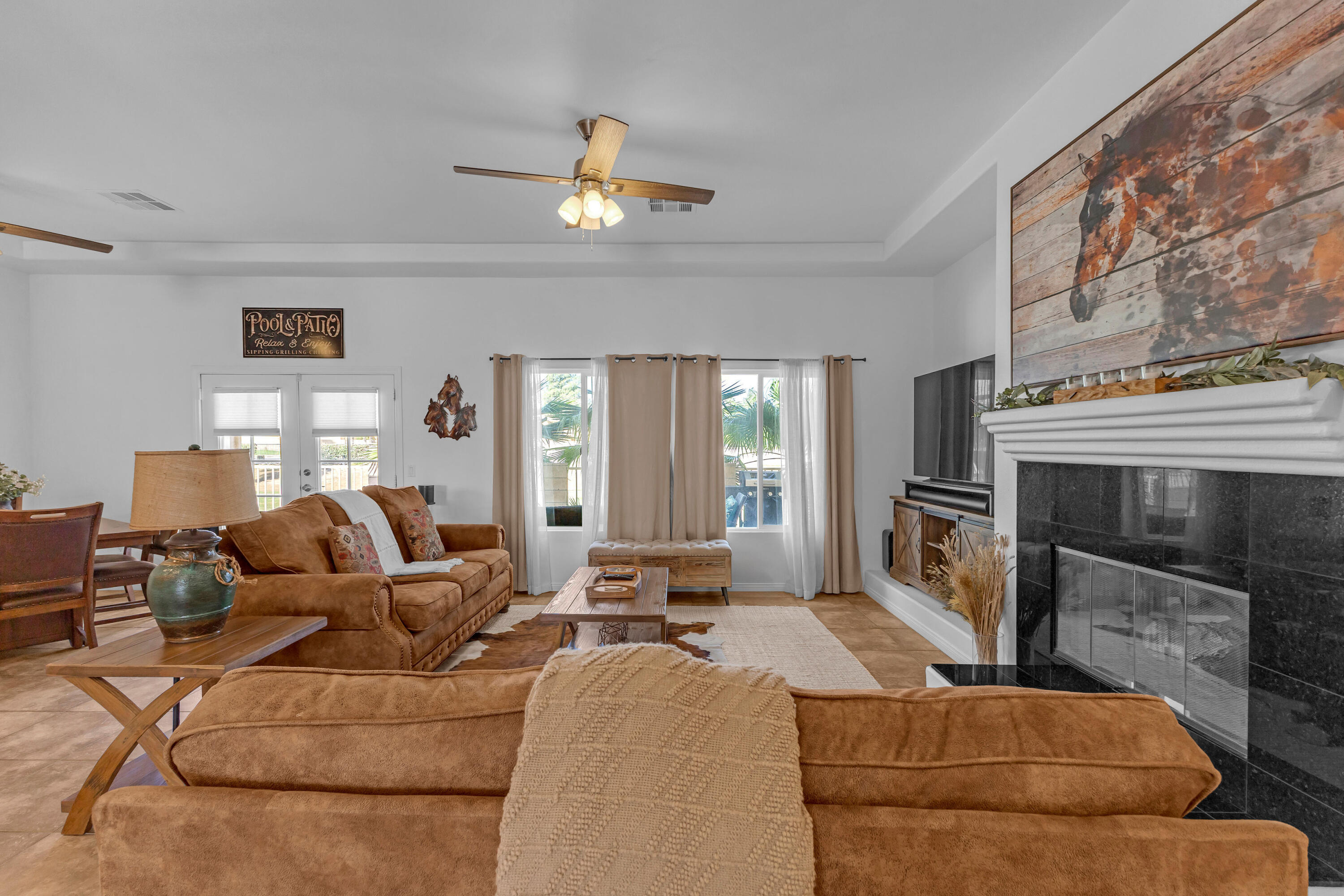 48305 Pic Way Indio, CA 92201 - Photo 20 of 77 a living room with furniture and a fireplace