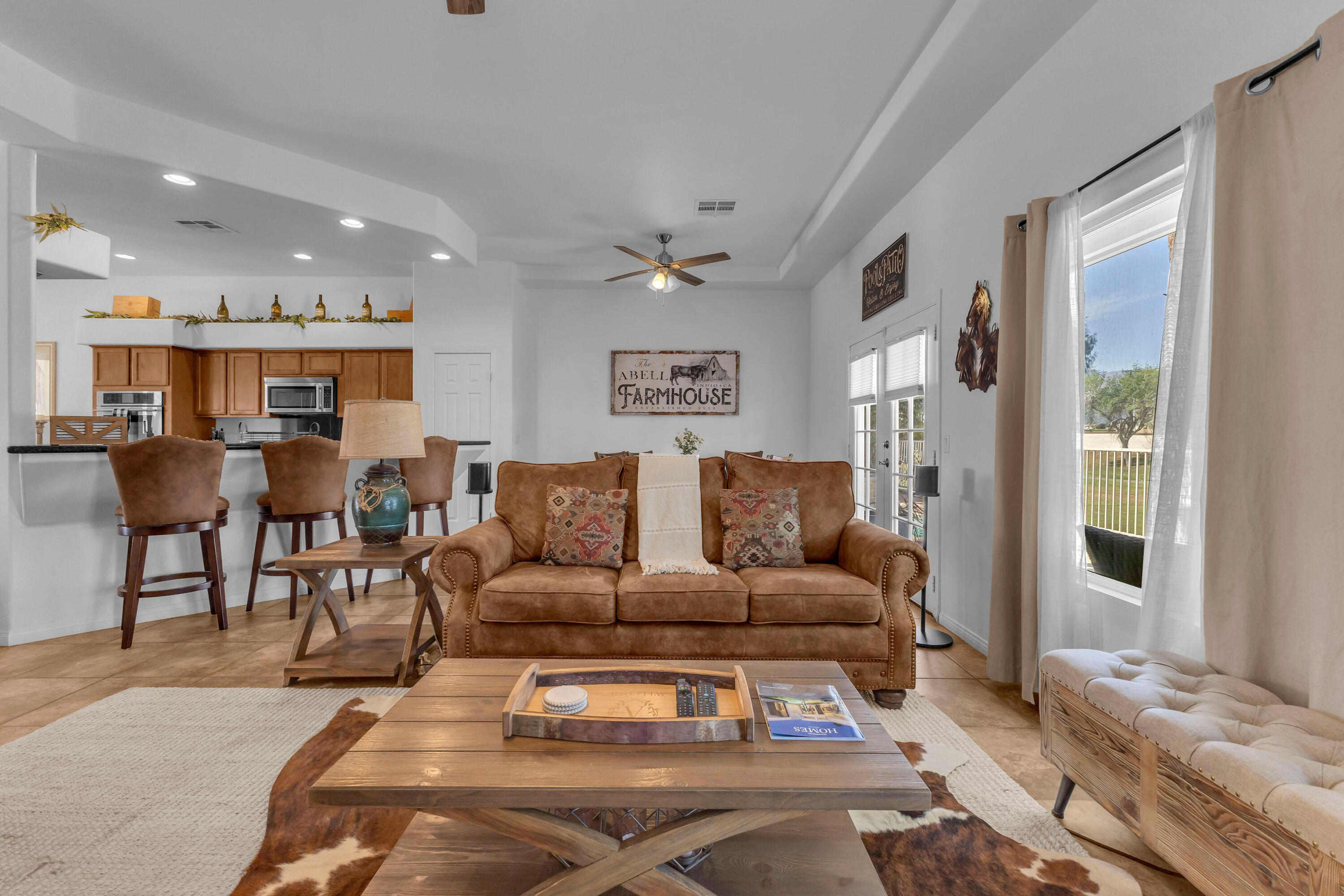48305 Pic Way Indio, CA 92201 - Photo 22 of 77 a living room with furniture and a large window