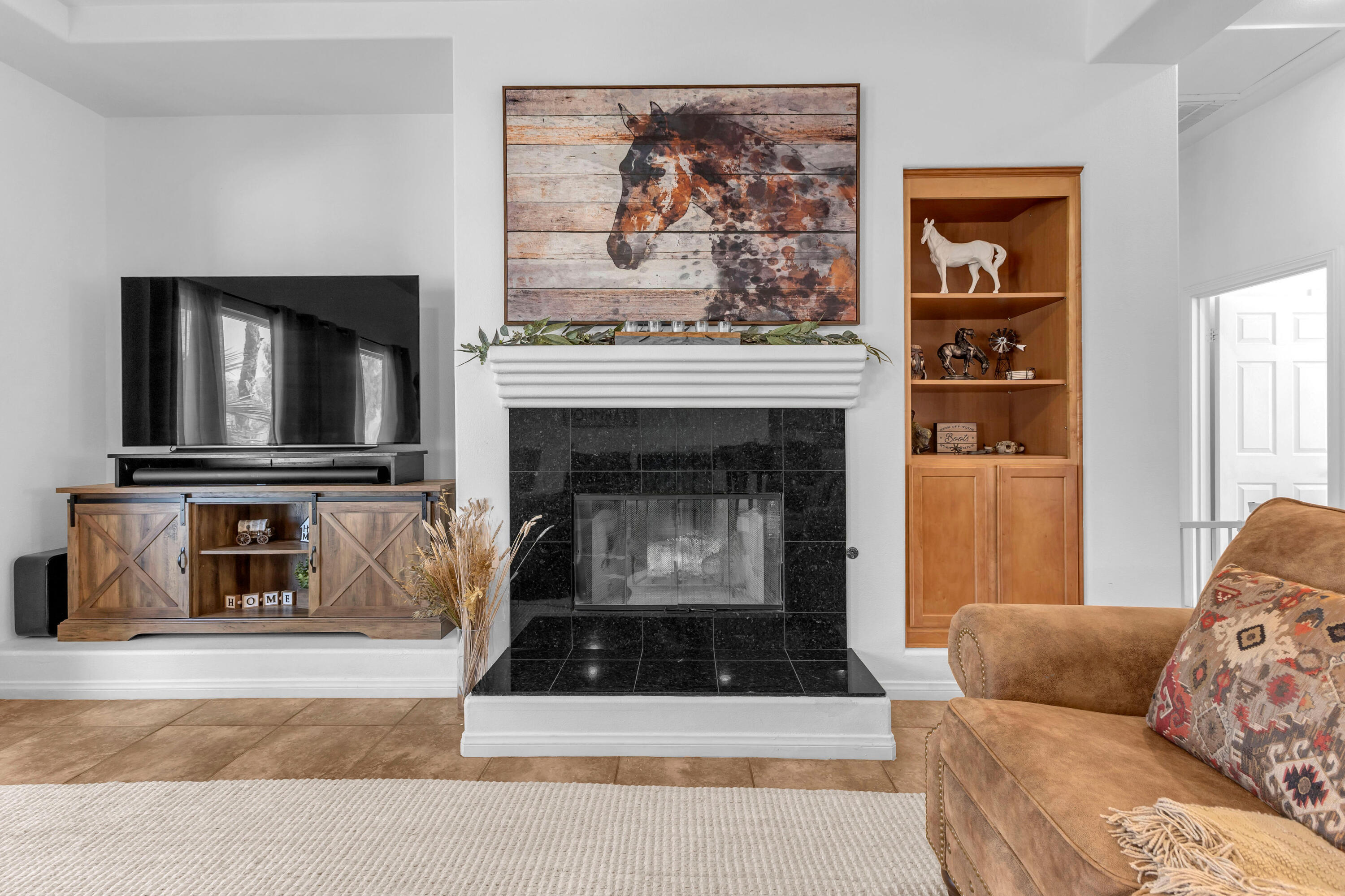 48305 Pic Way Indio, CA 92201 - Photo 26 of 77 a living room with furniture a flat screen tv and a fireplace
