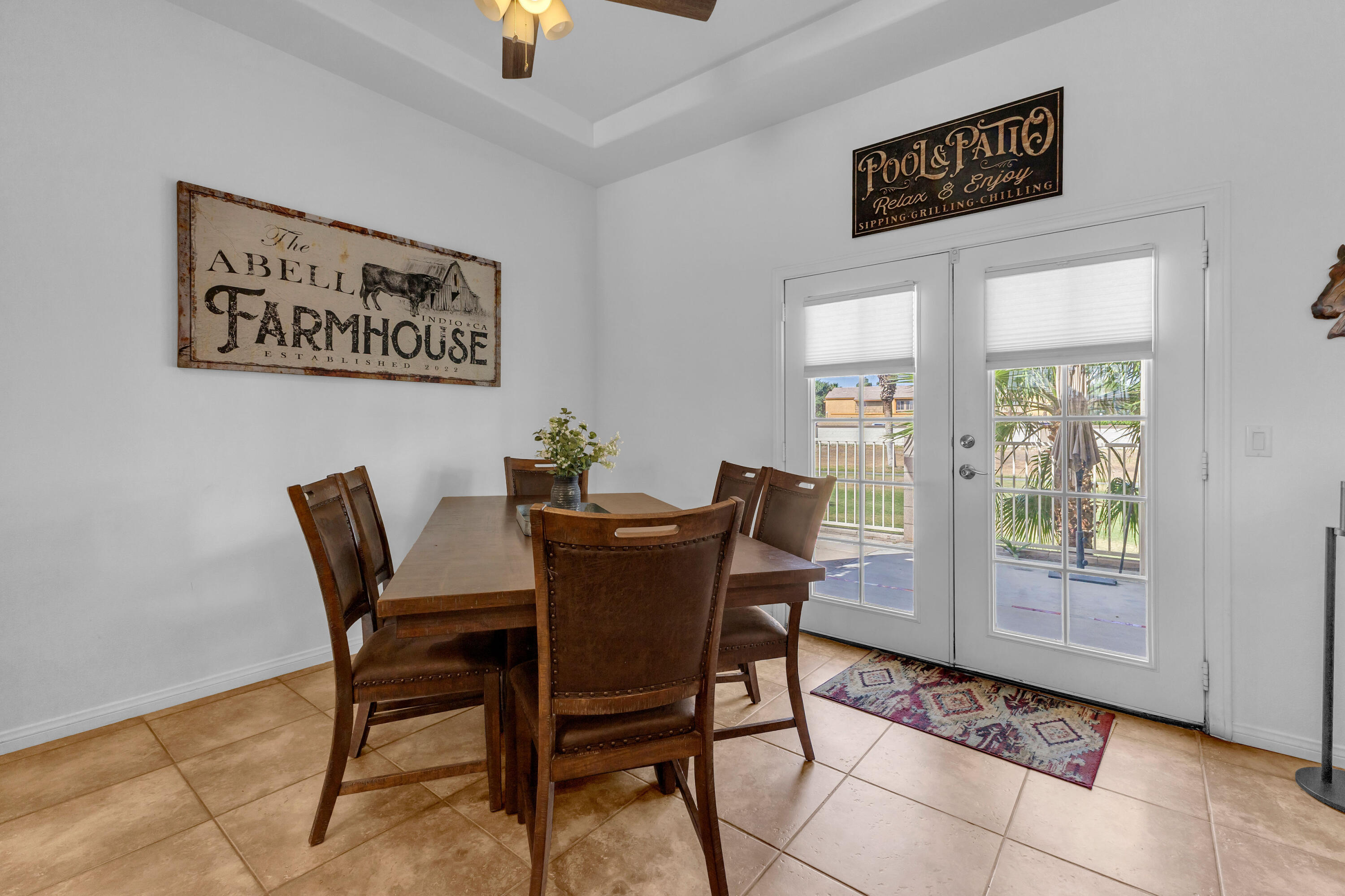 48305 Pic Way Indio, CA 92201 - Photo 27 of 77 a view of a dining room that has a table and chair in it