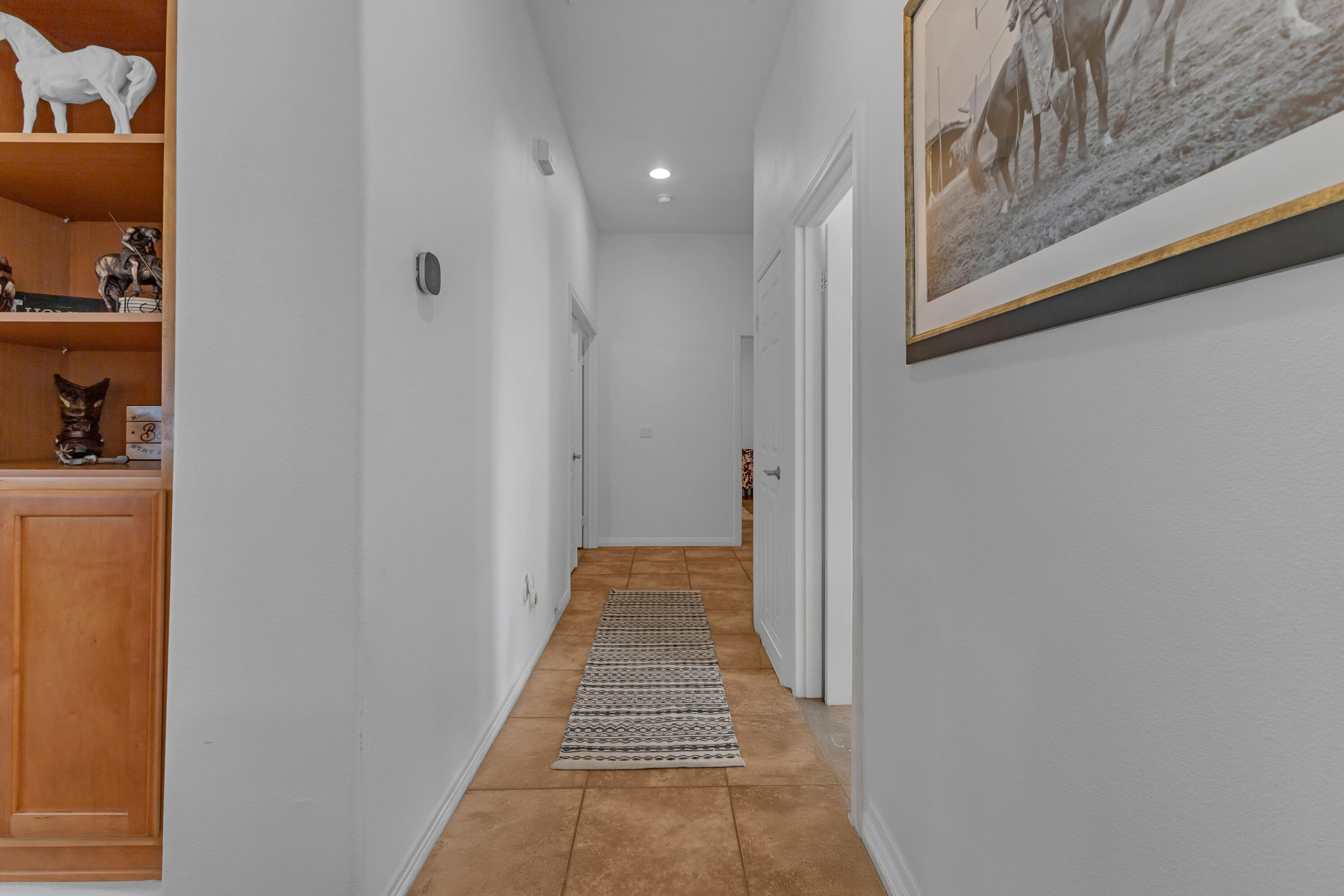 48305 Pic Way Indio, CA 92201 - Photo 29 of 77 a view of a hallway with closet and wooden floor