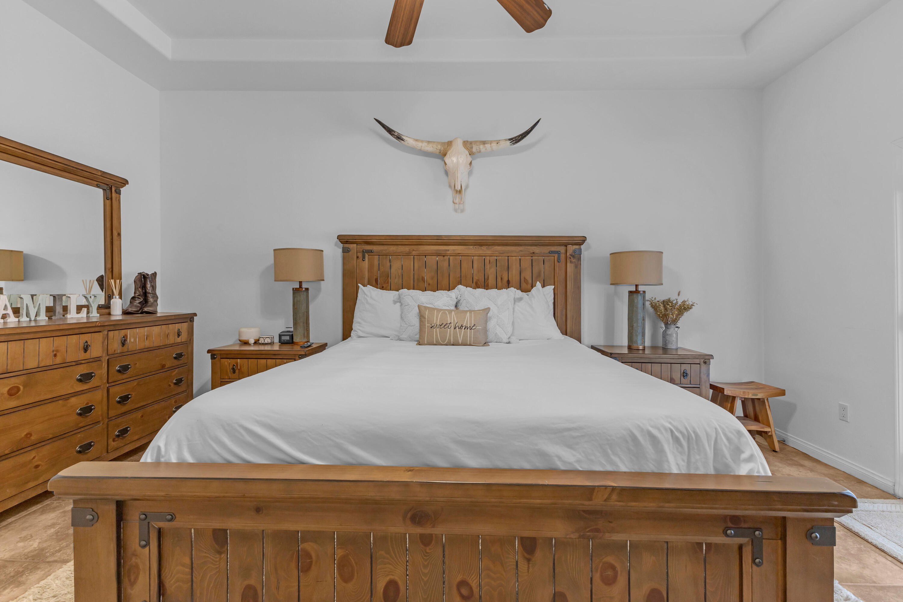 48305 Pic Way Indio, CA 92201 - Photo 31 of 77 a bedroom with a bed and a chandelier