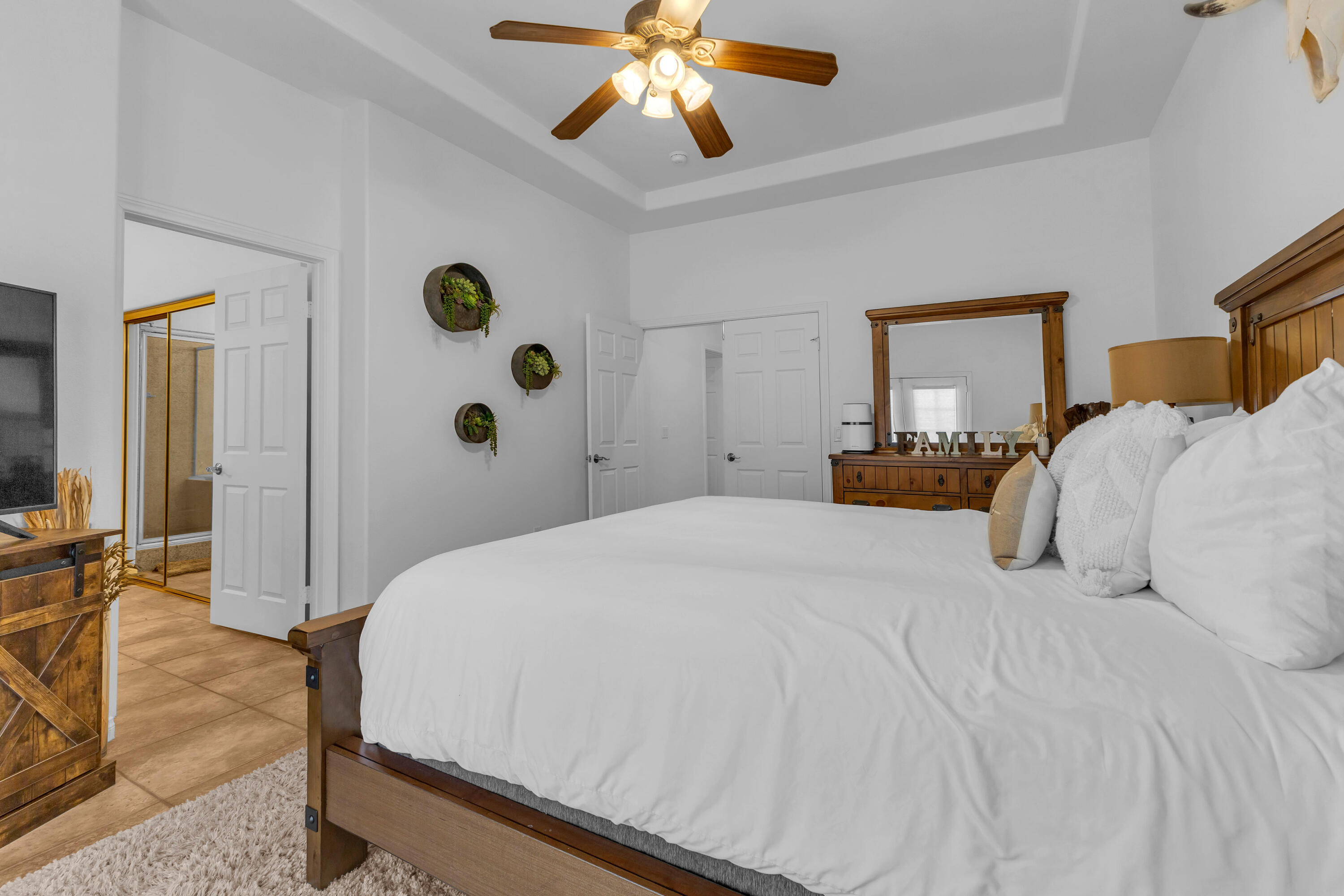 48305 Pic Way Indio, CA 92201 - Photo 32 of 77 a bedroom with a bed and a chandelier