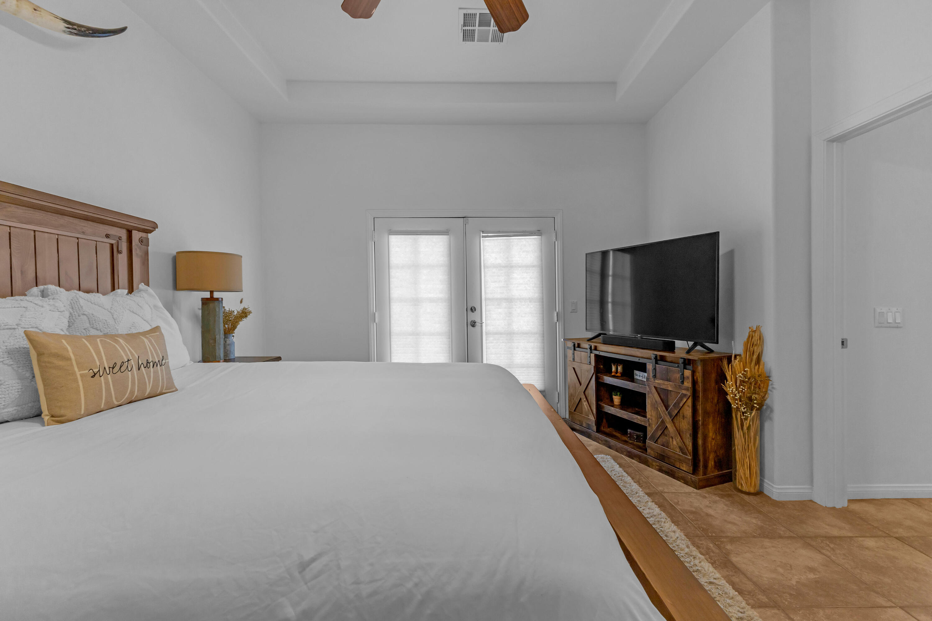 48305 Pic Way Indio, CA 92201 - Photo 33 of 77 a bedroom with furniture and a flat screen tv
