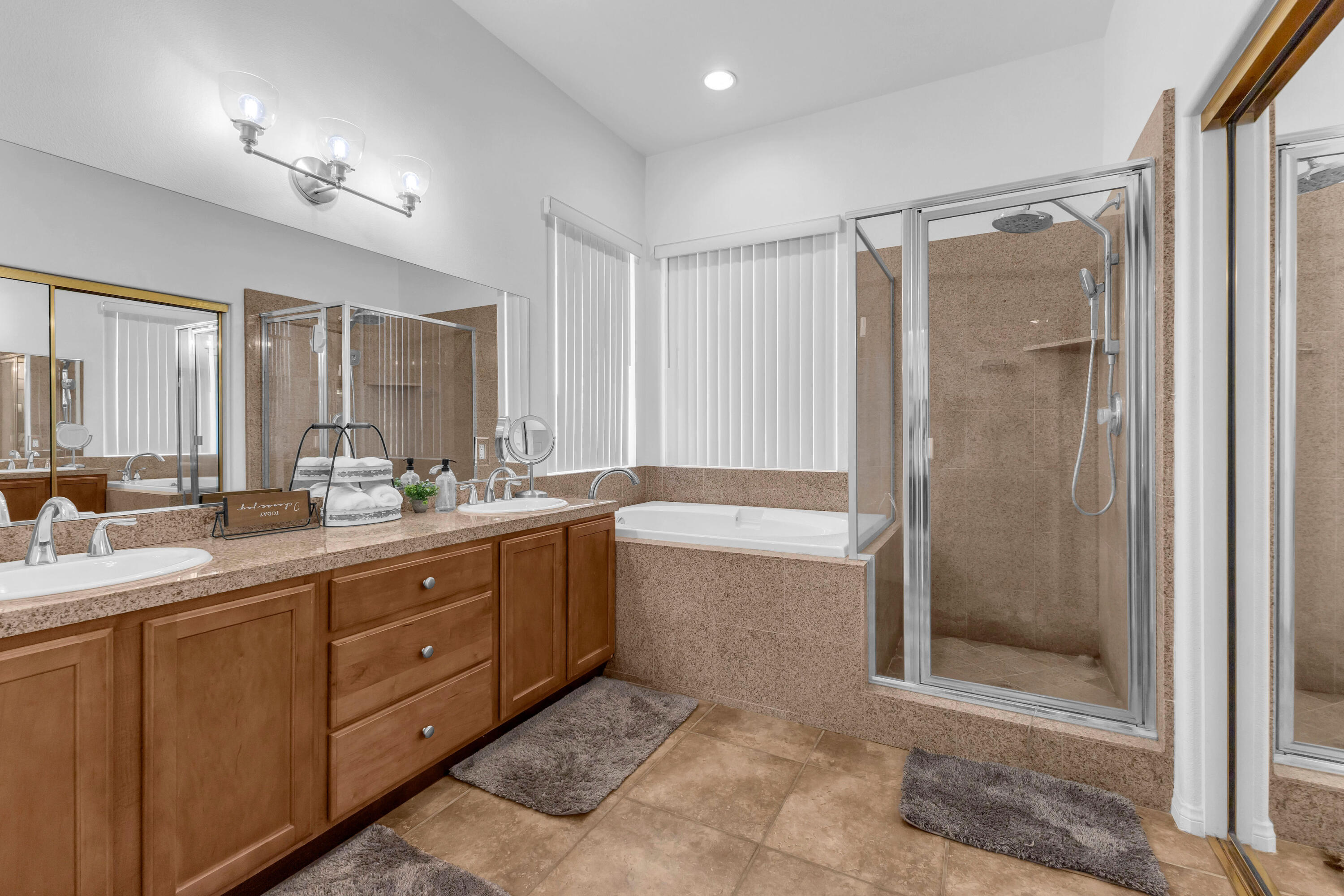 48305 Pic Way Indio, CA 92201 - Photo 34 of 77 a bathroom with a double vanity sink mirror and shower