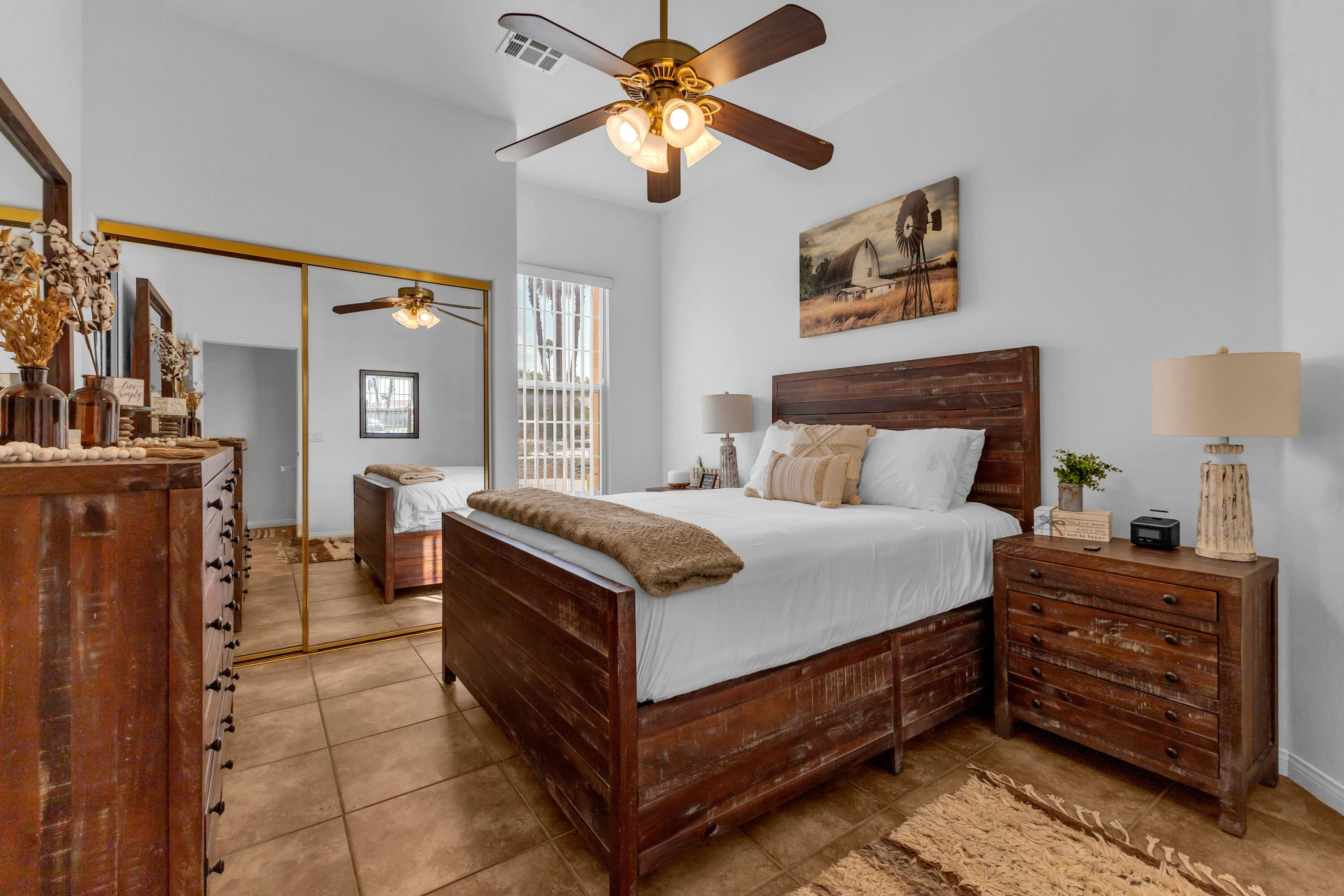 48305 Pic Way Indio, CA 92201 - Photo 37 of 77 a bedroom with a bed and a chandelier