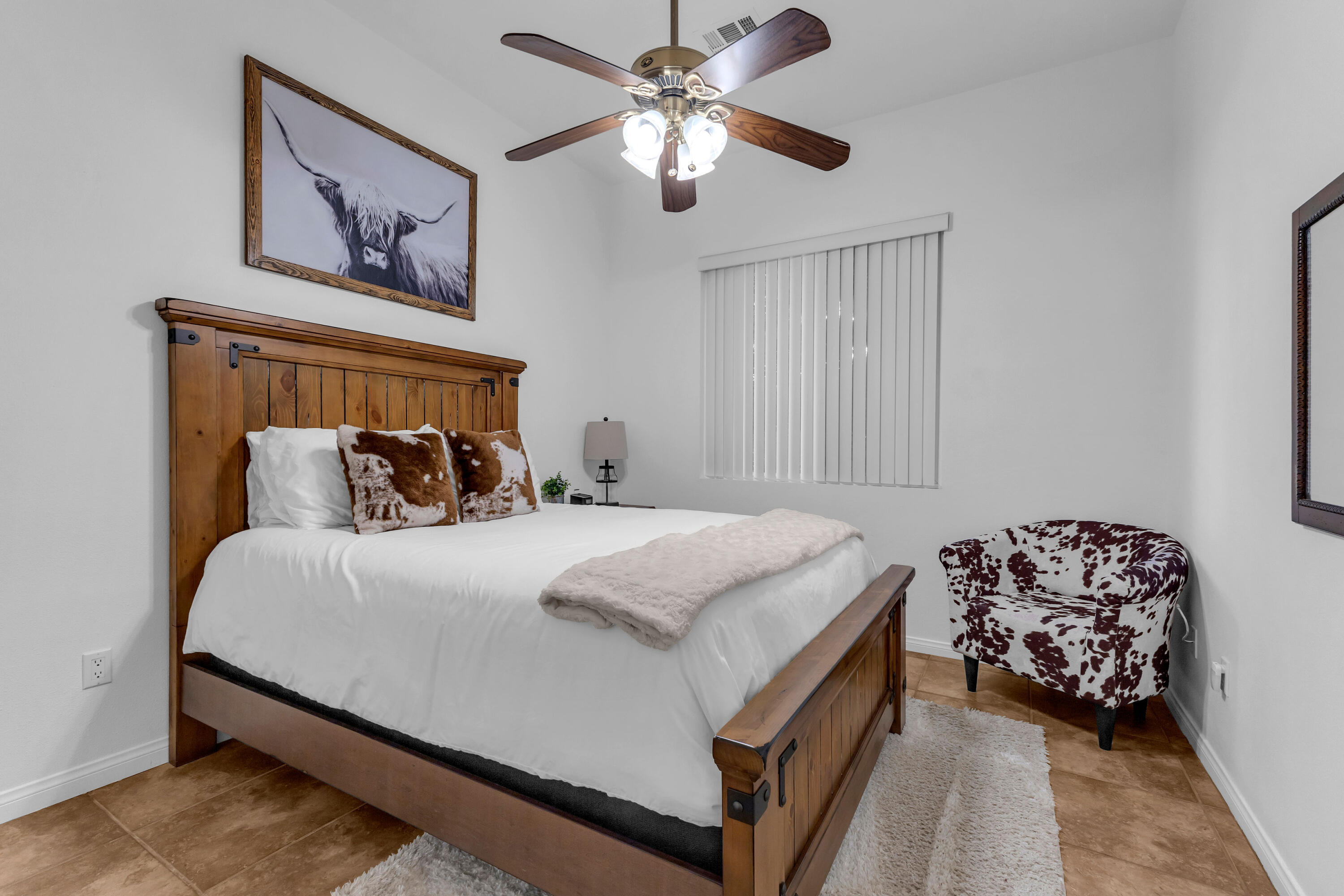 48305 Pic Way Indio, CA 92201 - Photo 41 of 77 a bedroom with a bed and a chandelier
