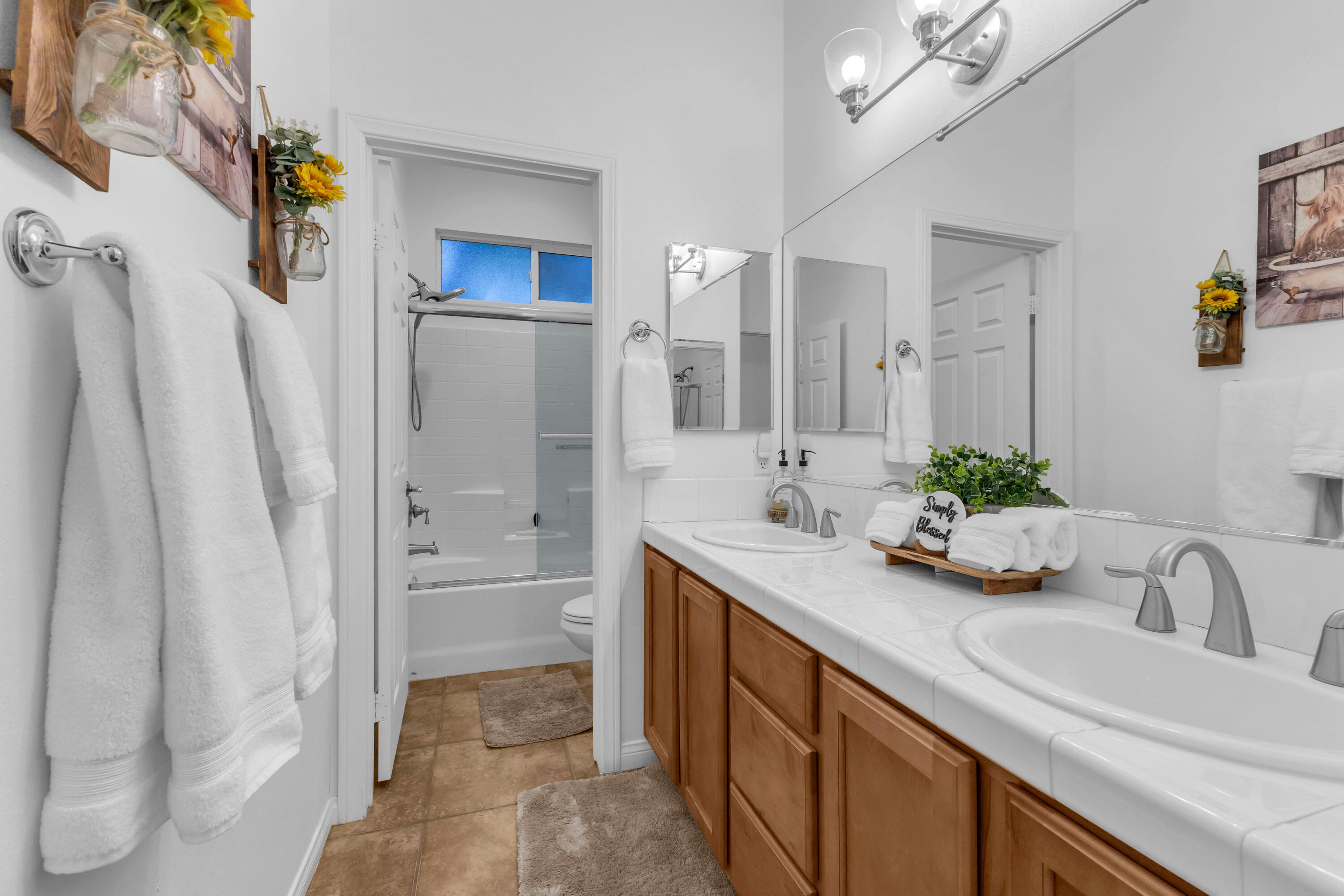 48305 Pic Way Indio, CA 92201 - Photo 45 of 77 a bathroom with a granite countertop sink and a mirror