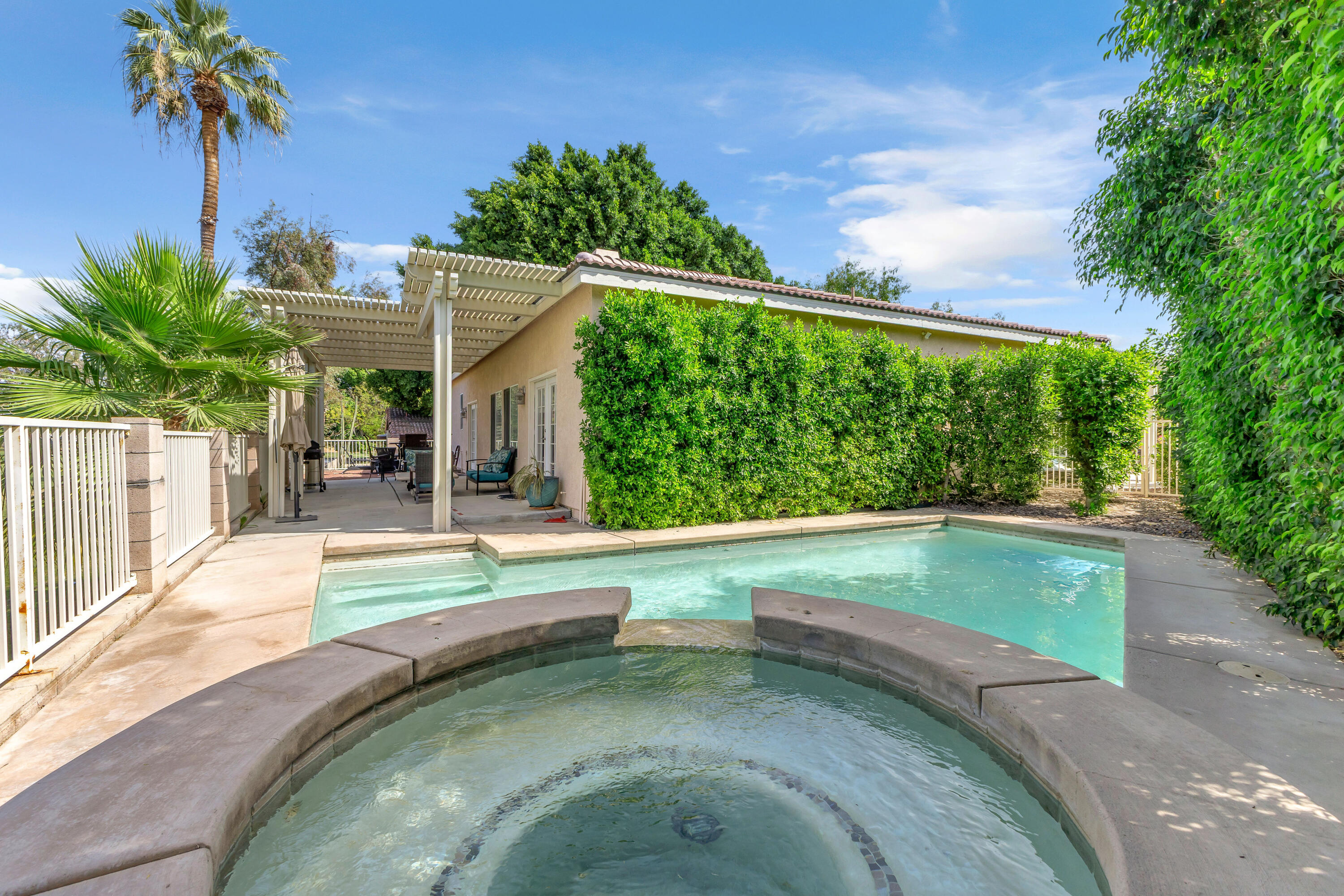 48305 Pic Way Indio, CA 92201 - Photo 51 of 77 a view of a swimming pool with a patio