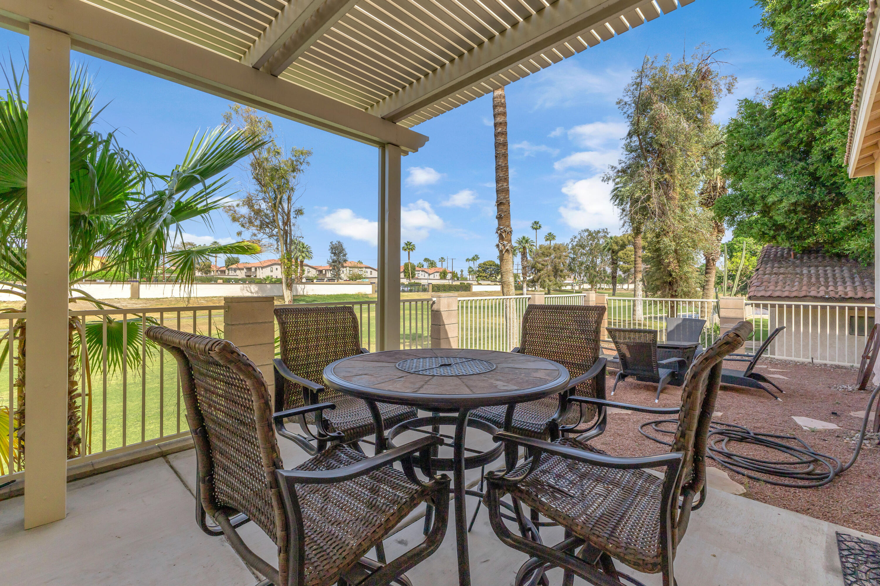 48305 Pic Way Indio, CA 92201 - Photo 57 of 77 a view of a chairs and table in patio