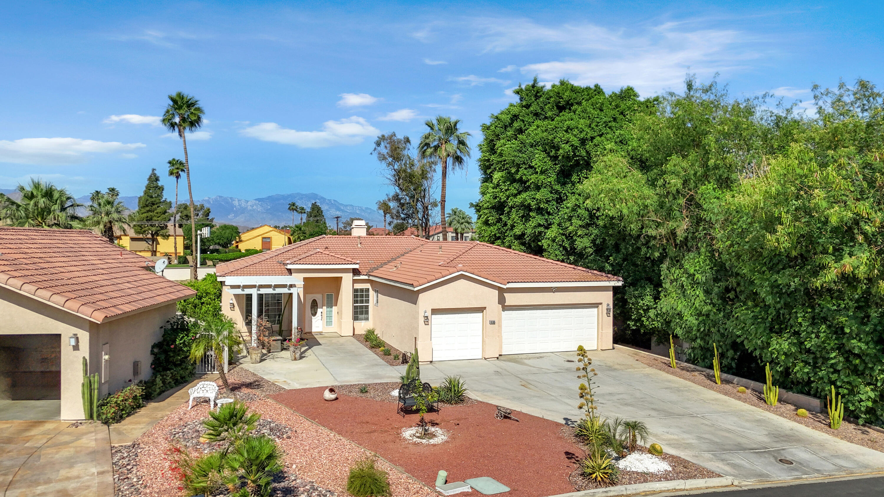 48305 Pic Way Indio, CA 92201 - Photo 60 of 77 a front view of a house with garden