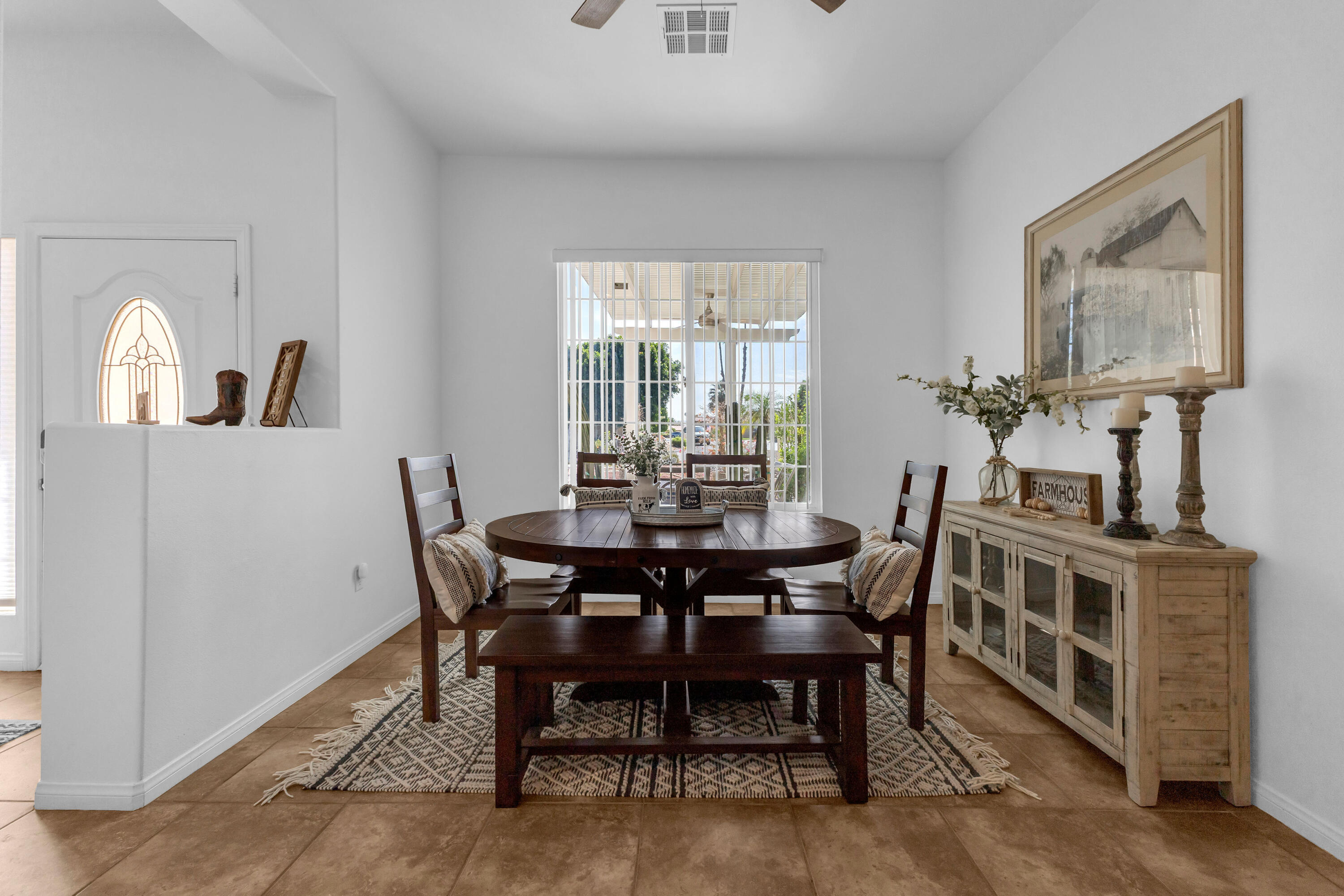 48305 Pic Way Indio, CA 92201 - Photo 8 of 77 a view of a dining room with furniture window and wooden floor