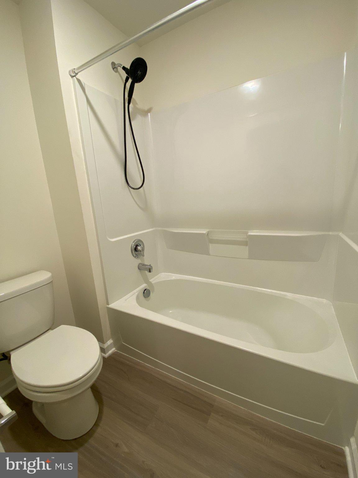 697 Rivanna Run Falling Waters, WV 25419 - Photo 30 of 44 a bathroom with a toilet and a bath tub