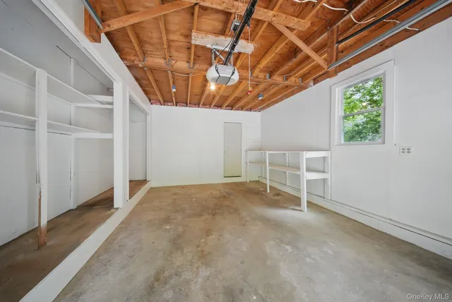 a view of empty room with windows