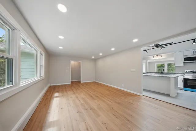 a view of an empty room with a window