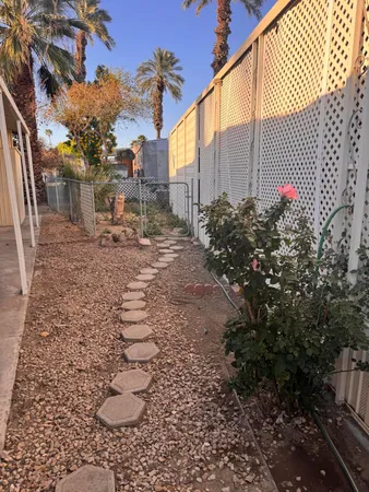 a view of a pathway with a yard