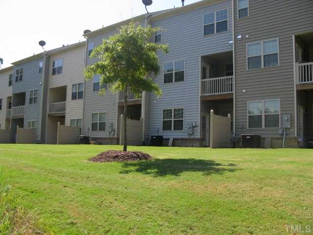 8306 Primanti Boulevard Raleigh, NC 27612 - Photo 21 of 22 Back view of townhome which back up to wooded area