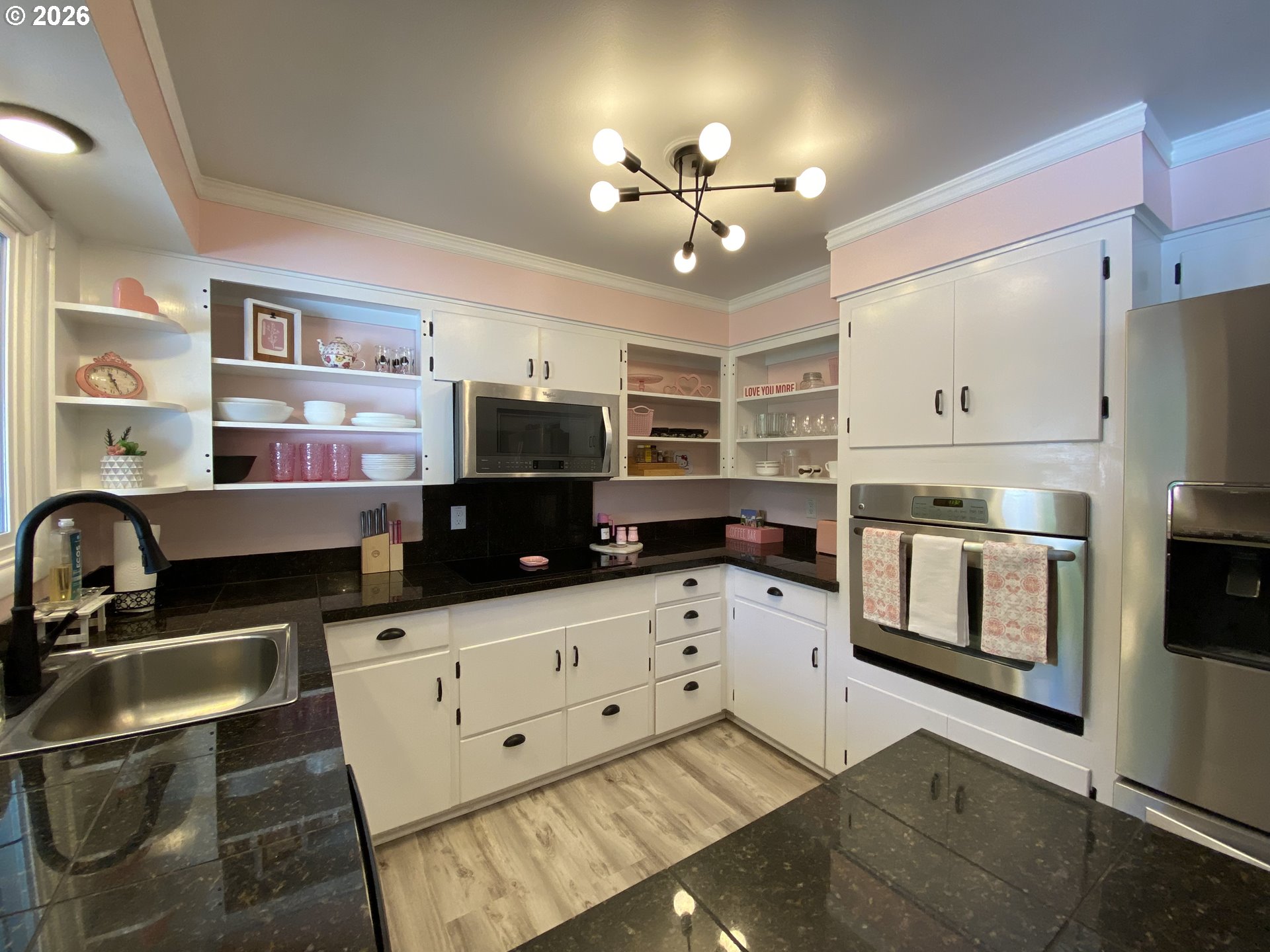 2872 Suffolk Court Eugene, OR 97401 - Photo 12 of 36 a kitchen with stainless steel appliances a stove sink and microwave
