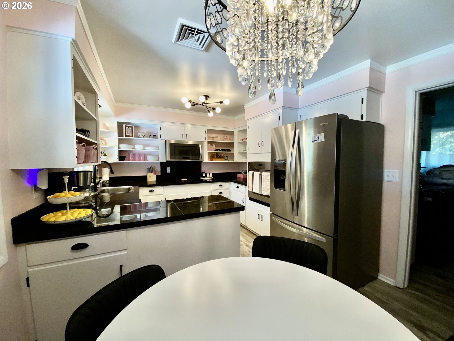 2872 Suffolk Court Eugene, OR 97401 - Photo 15 of 36 a kitchen with stainless steel appliances a sink refrigerator and cabinets