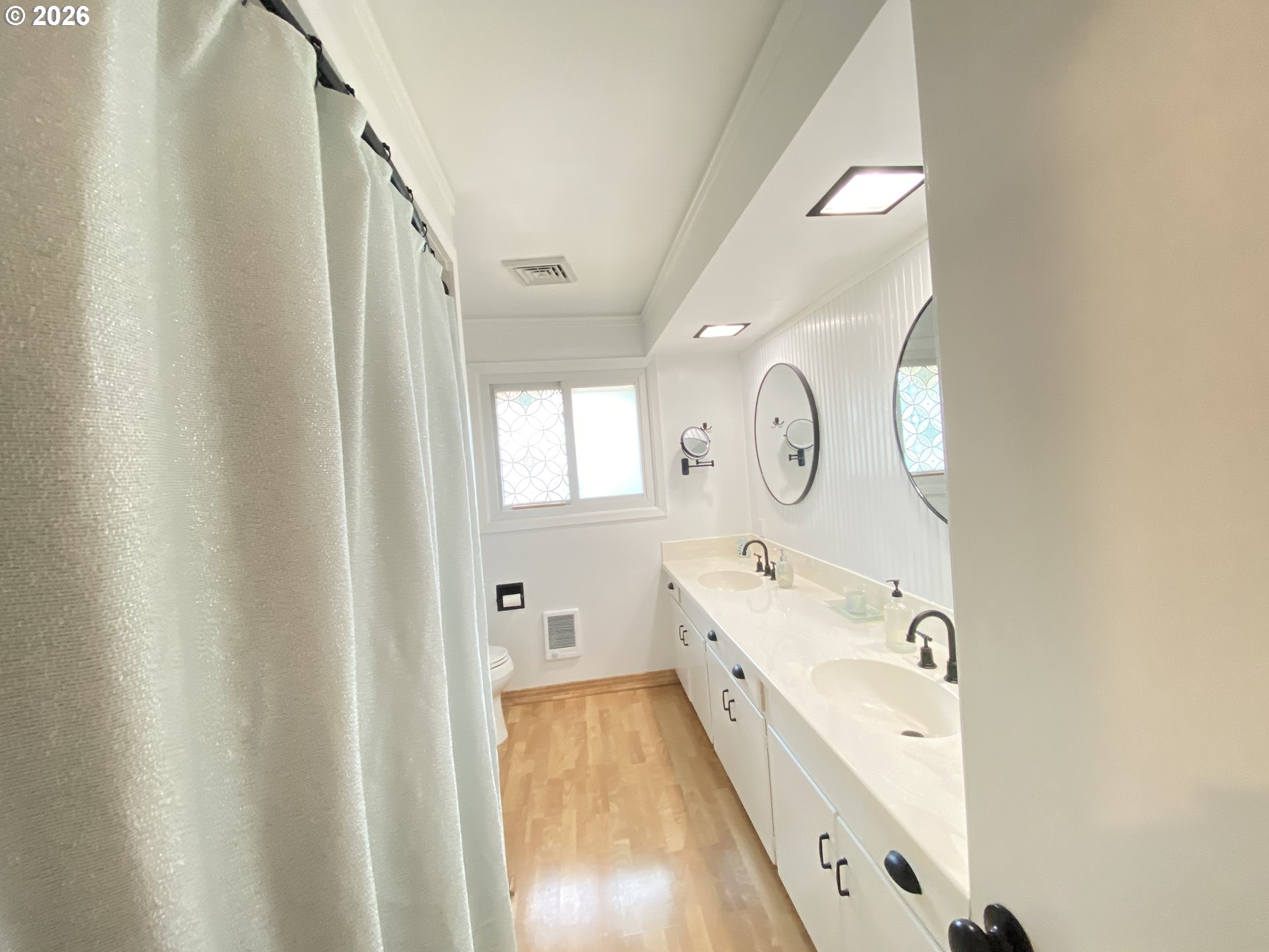 2872 Suffolk Court Eugene, OR 97401 - Photo 25 of 36 a spacious bathroom with a double vanity sink and a mirror