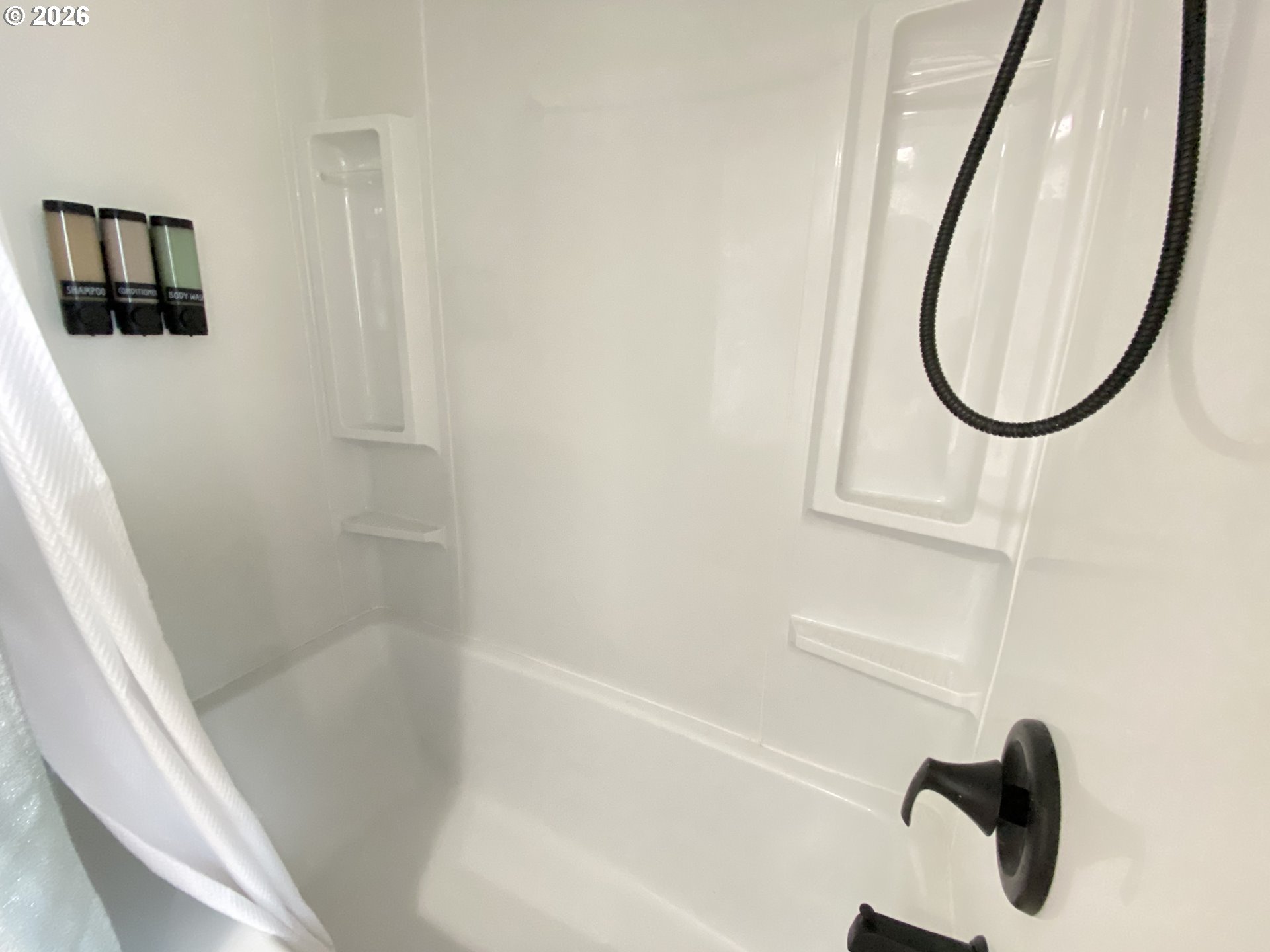 2872 Suffolk Court Eugene, OR 97401 - Photo 27 of 36 a bathroom with a tub and a shower