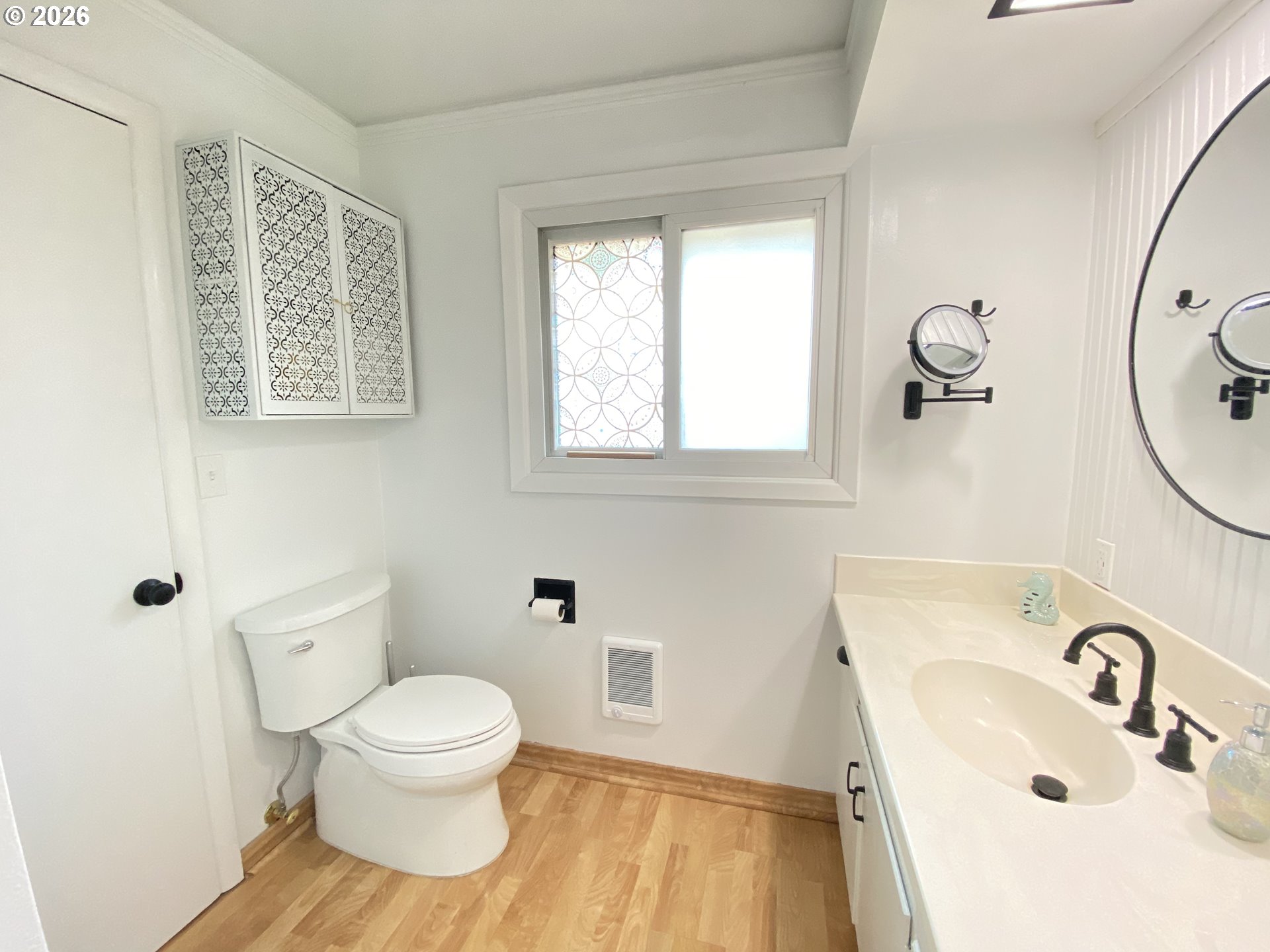 2872 Suffolk Court Eugene, OR 97401 - Photo 28 of 36 a bathroom with a sink a toilet and a mirror