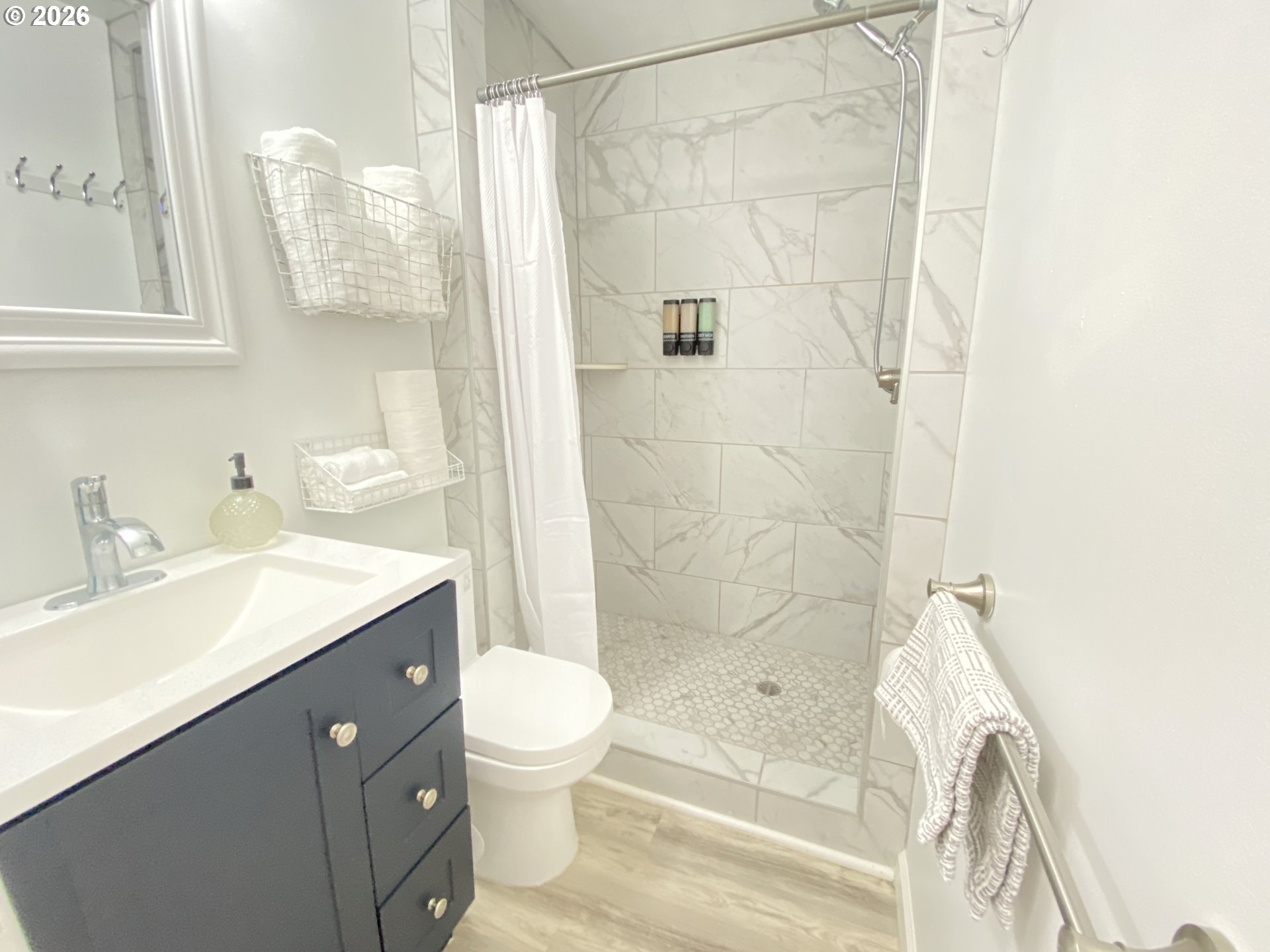 2872 Suffolk Court Eugene, OR 97401 - Photo 29 of 36 a bathroom with a sink a toilet and shower