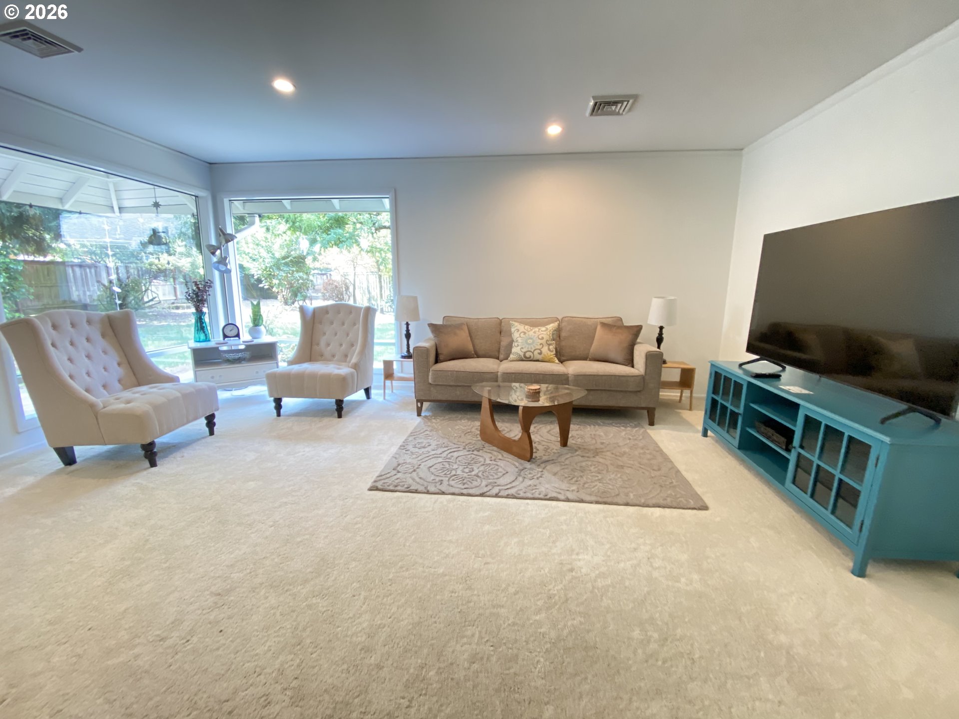 2872 Suffolk Court Eugene, OR 97401 - Photo 8 of 36 a living room with furniture and a flat screen tv