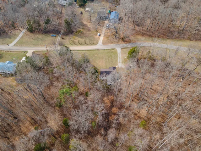 a view of yard with snow on the road