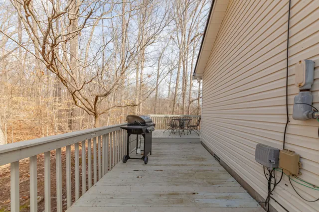 a view of a chairs and table on the balcony