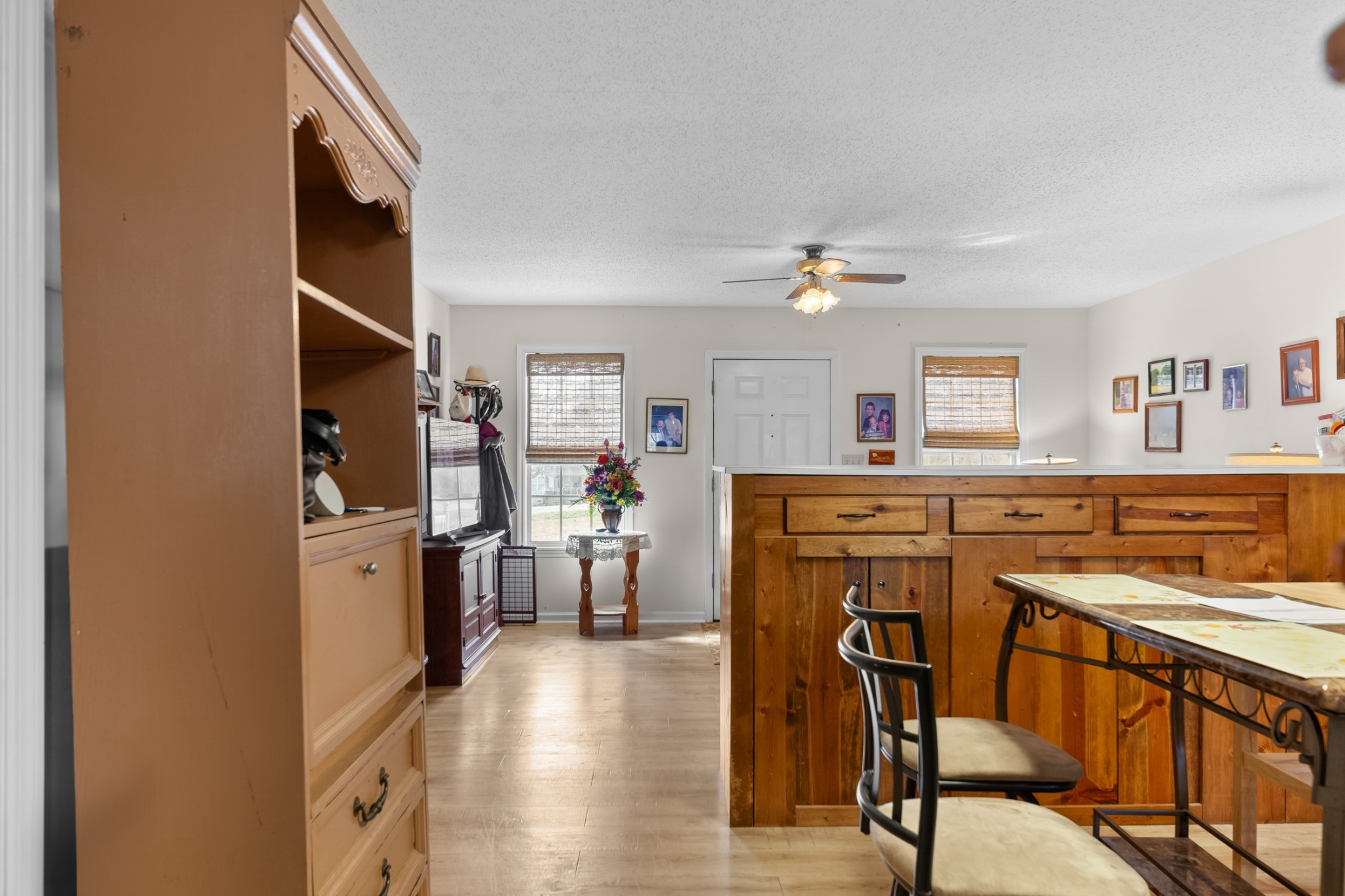 2640 Winding Way Road Culleoka, TN 38451 - Photo 40 of 51 a kitchen with a table chairs refrigerator and cabinets