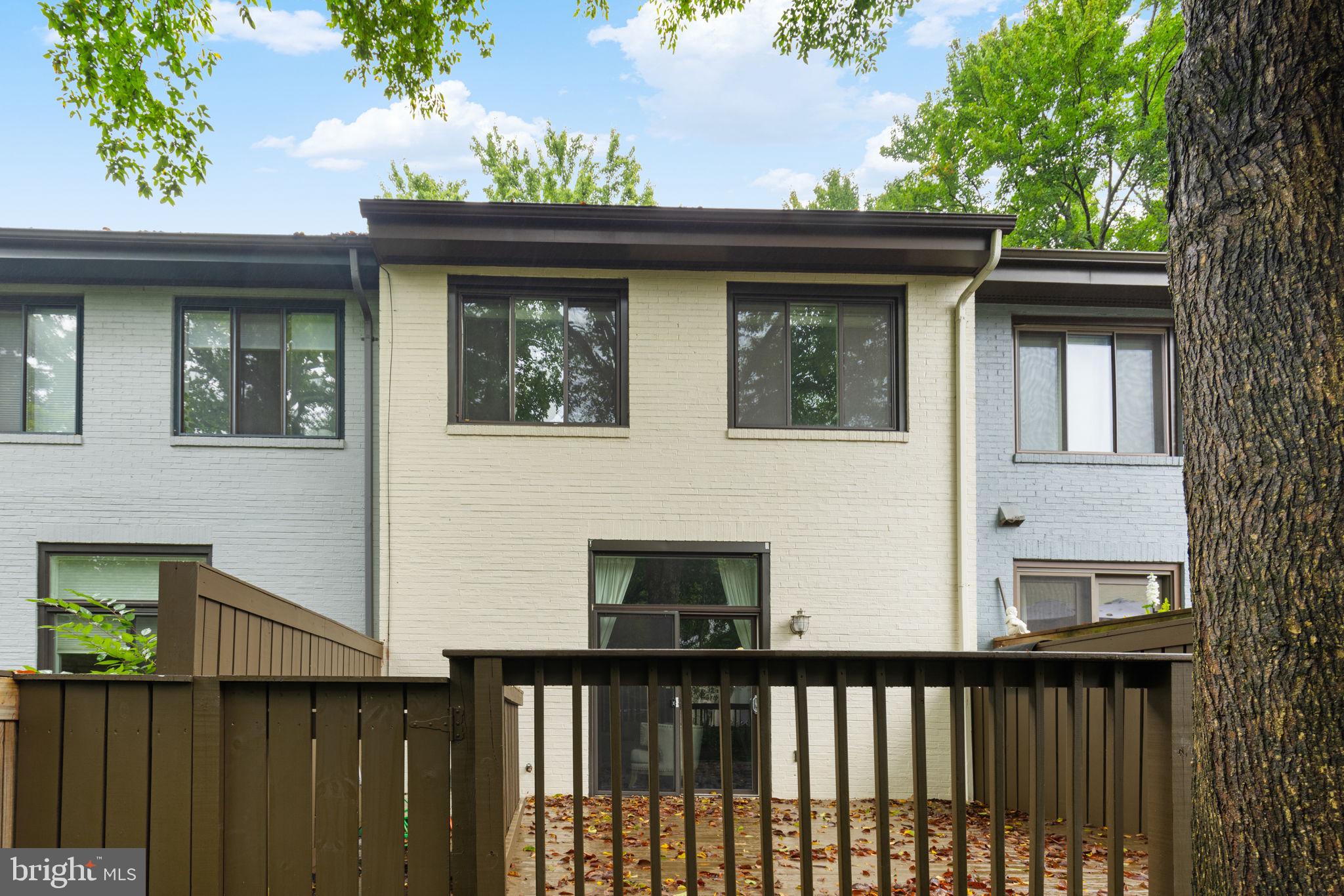 2050 Golf Course Drive Reston, VA 20191 - Photo 35 of 40 a front view of a house with a yard