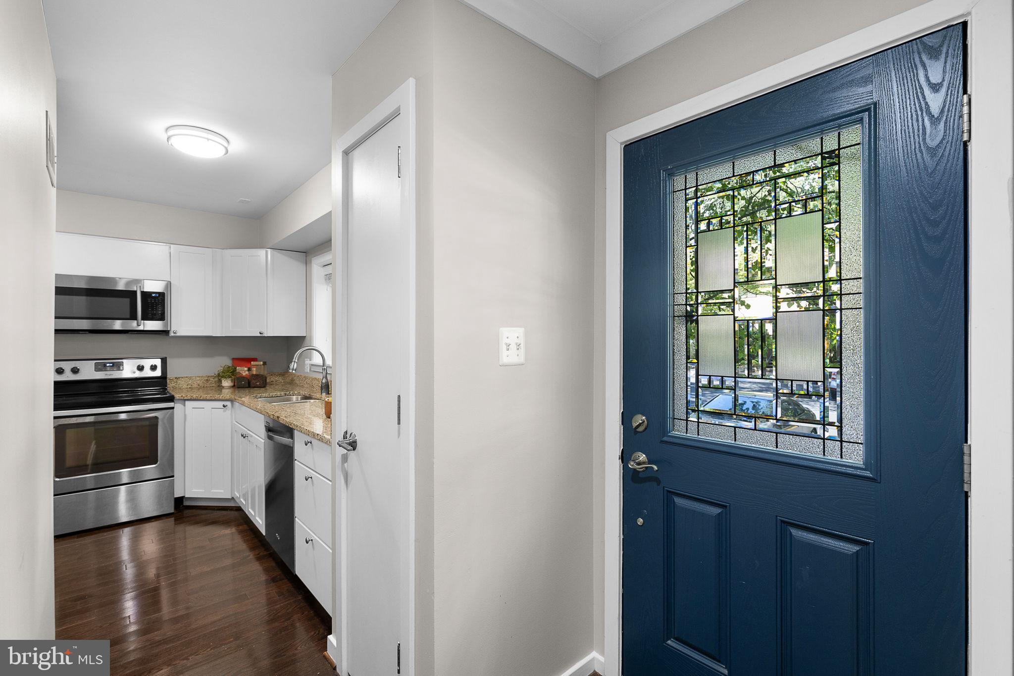 2050 Golf Course Drive Reston, VA 20191 - Photo 5 of 40 a kitchen with stainless steel appliances granite countertop a refrigerator and a stove