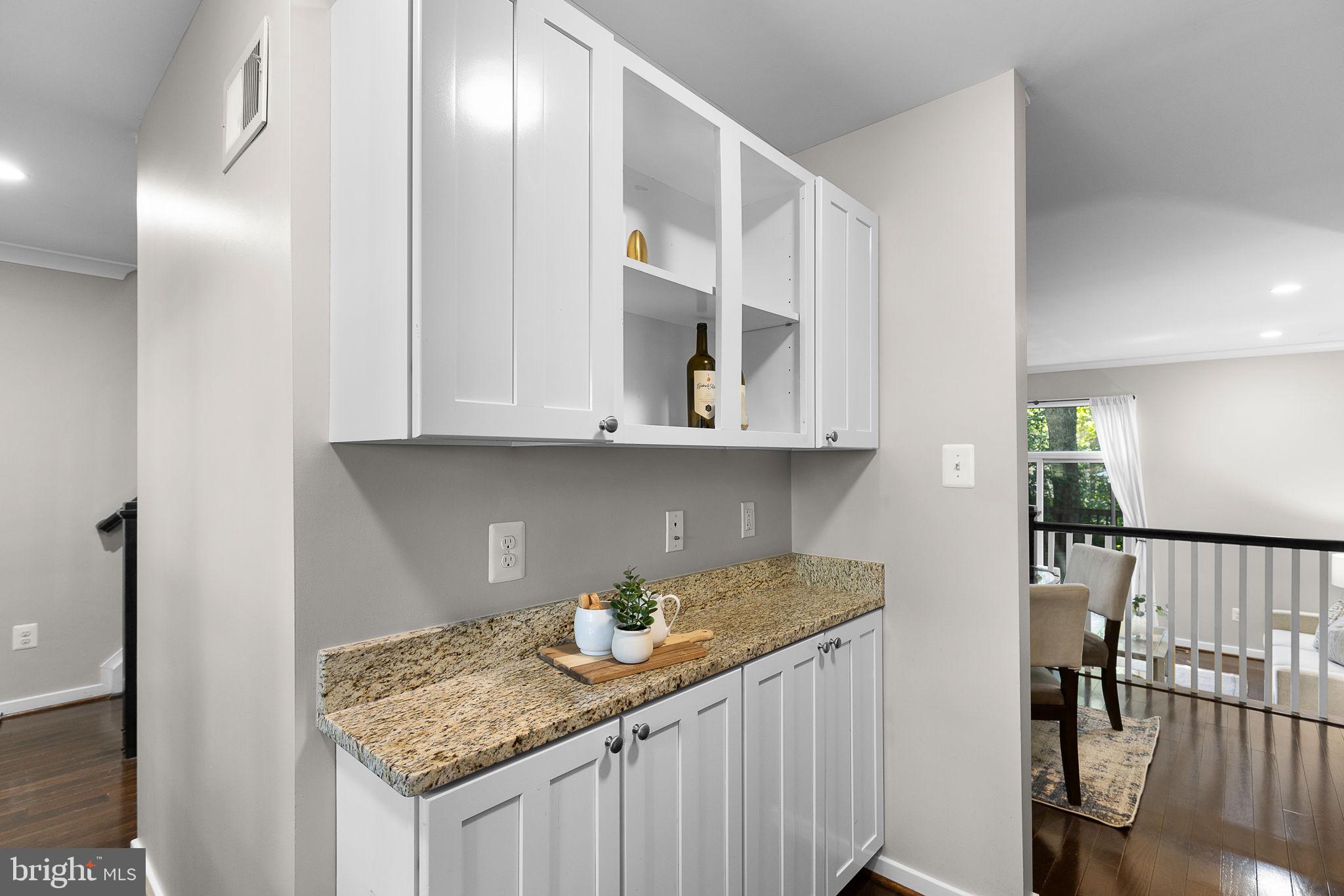 2050 Golf Course Drive Reston, VA 20191 - Photo 7 of 40 a kitchen with stainless steel appliances granite countertop a sink and cabinets