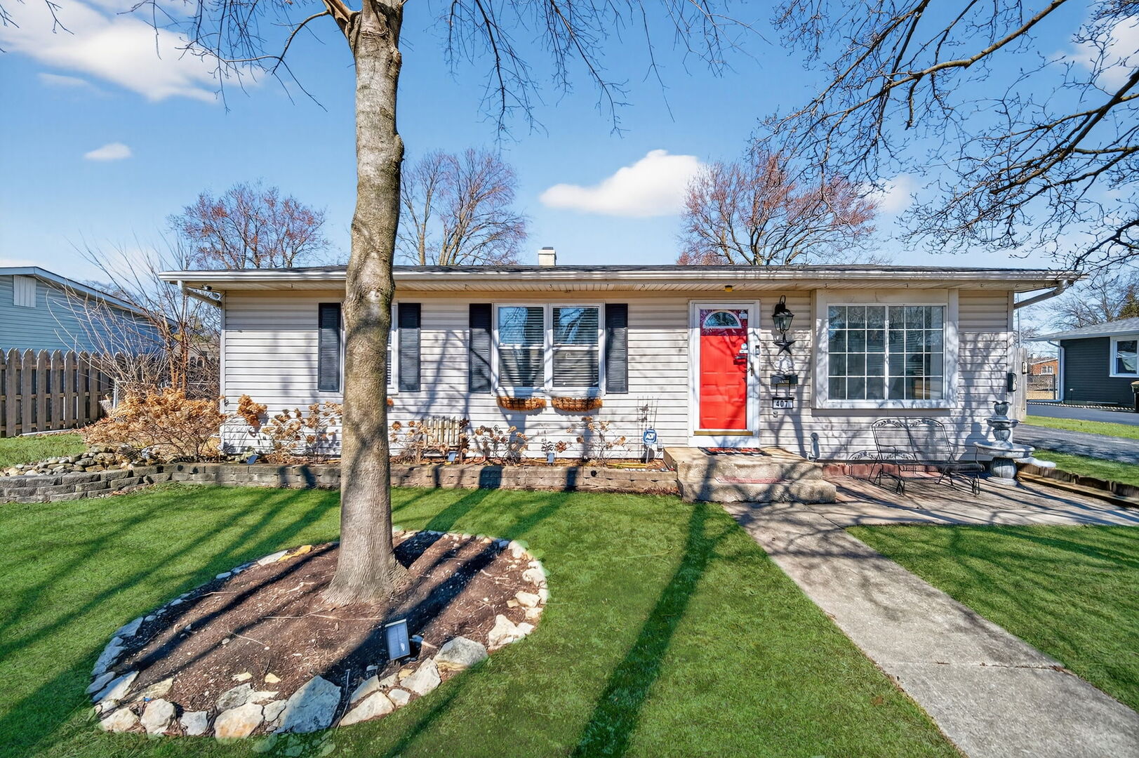 407 Butterfield Road North Aurora, IL 60542 - Photo 1 of 50 a view of a house with backyard sitting area and garden