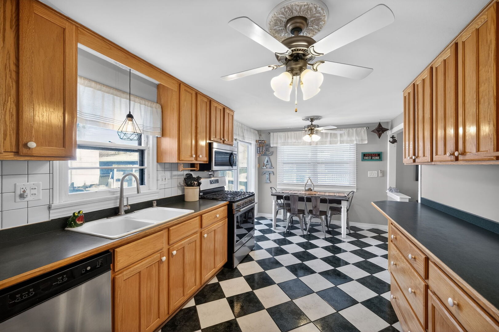 407 Butterfield Road North Aurora, IL 60542 - Photo 11 of 50 a kitchen with a sink a counter cabinets and appliances
